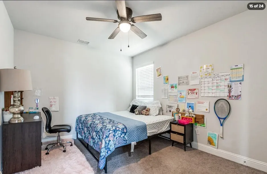 Ceiling fan with integrated lighting, window with blinds, light gray wall paint, and carpeted flooring