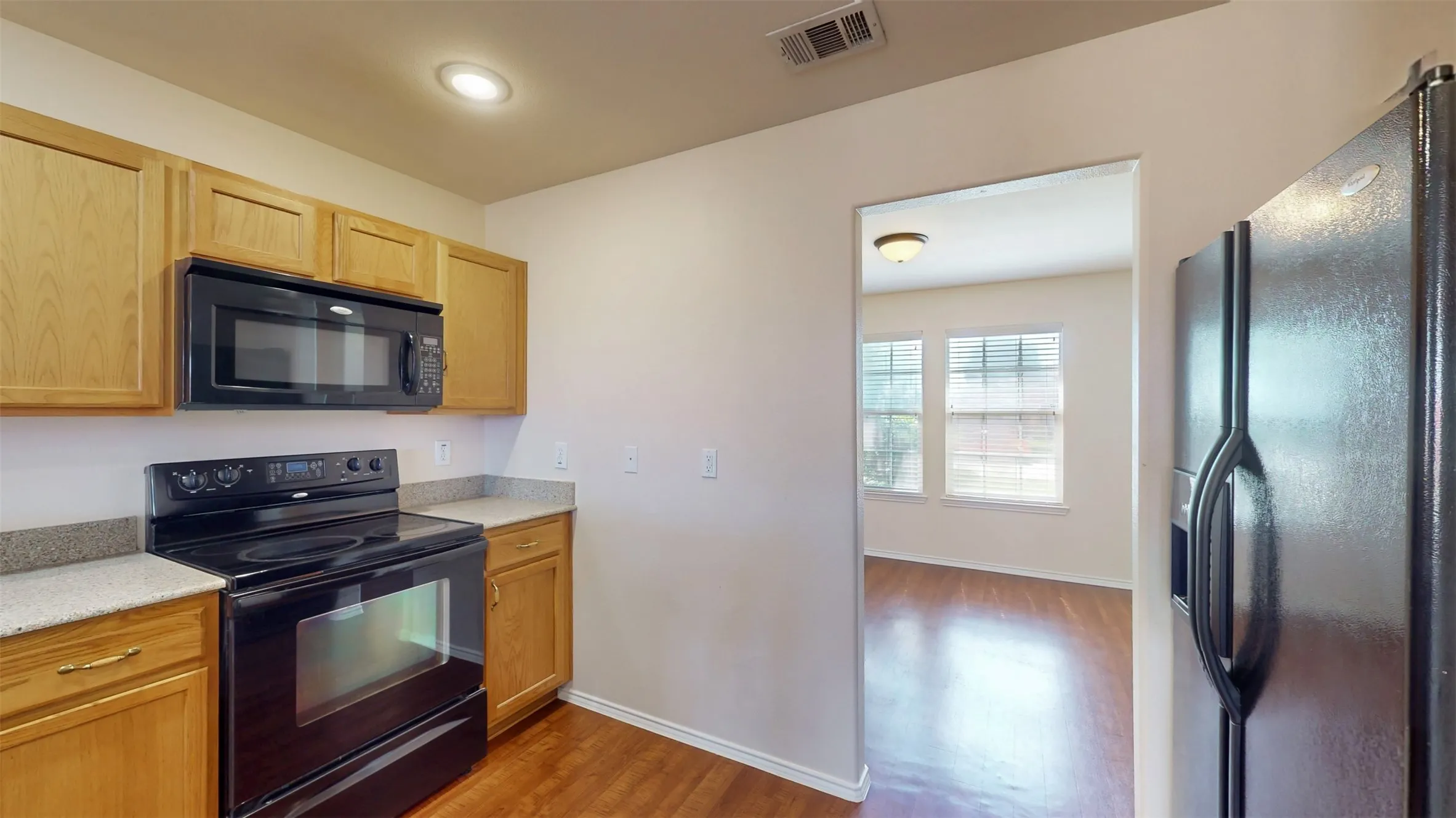 Wood-look laminate floors in the kitchen and dining room.