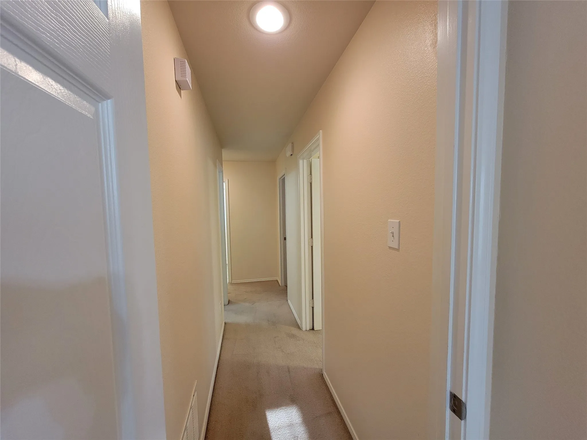 Hallway to additional bedrooms, from the main bedroom view.
