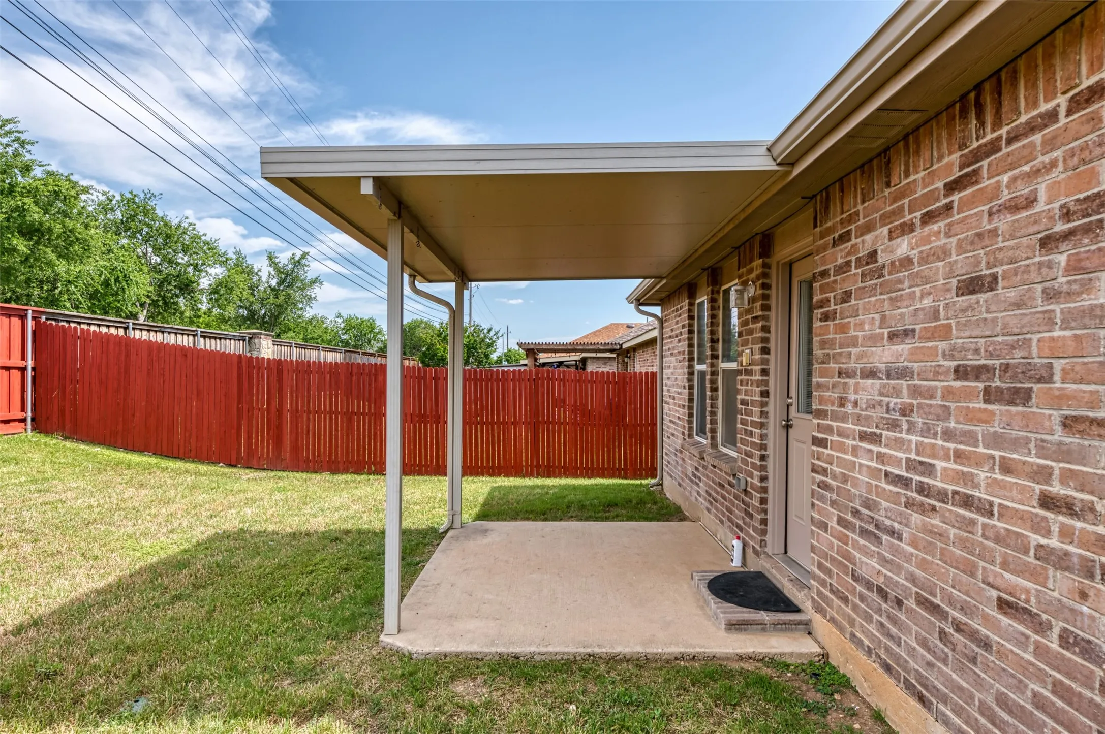 Backyard is complete with a covered back patio!