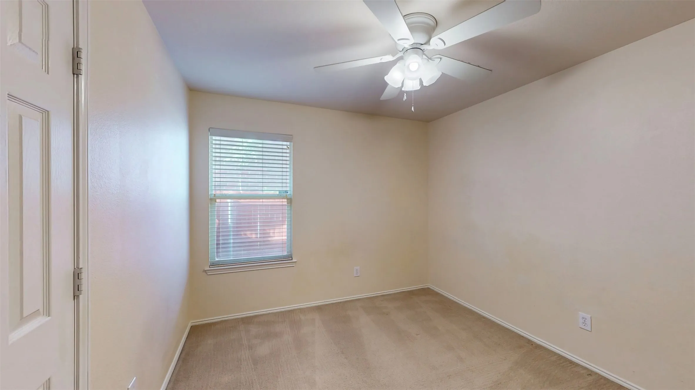Bedroom 3 with window blinds and its own ceiling fan!