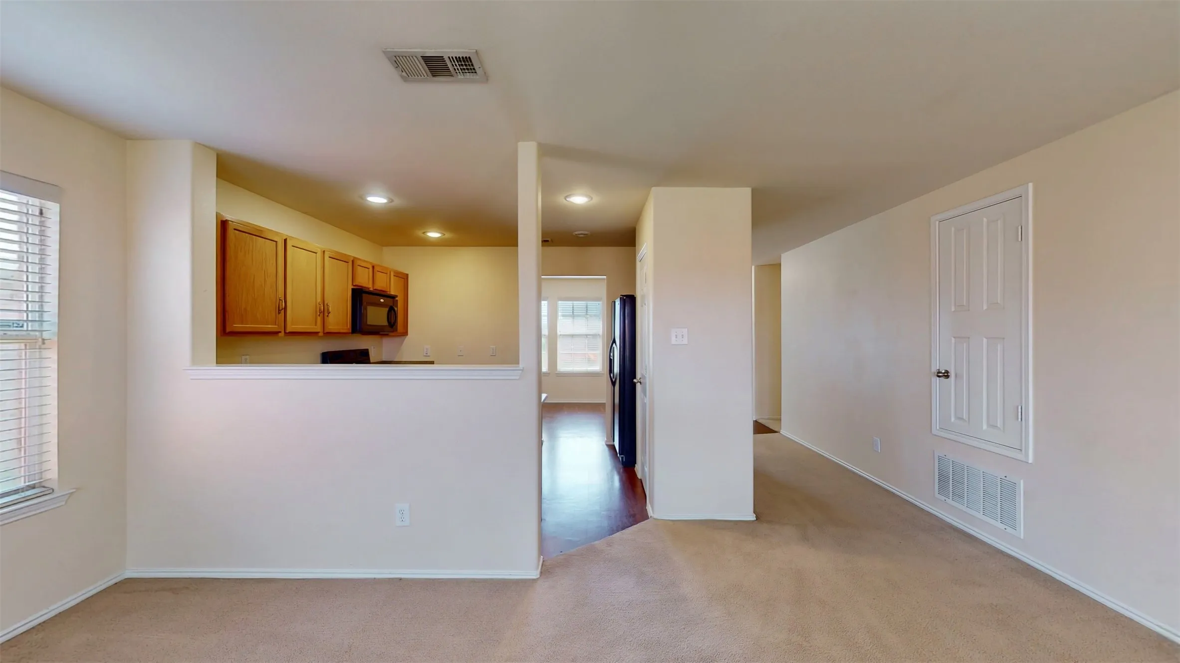Recessed-style lighting and pantry in the kitchen!