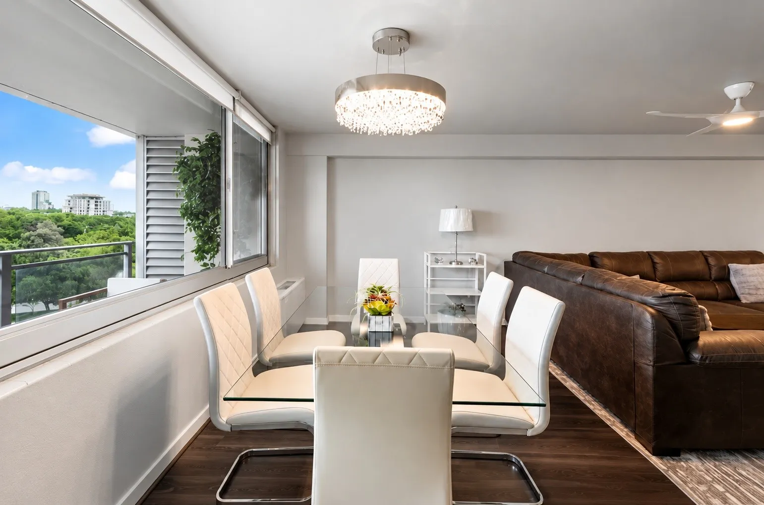 Spacious interior with wood-finish flooring and light gray walls