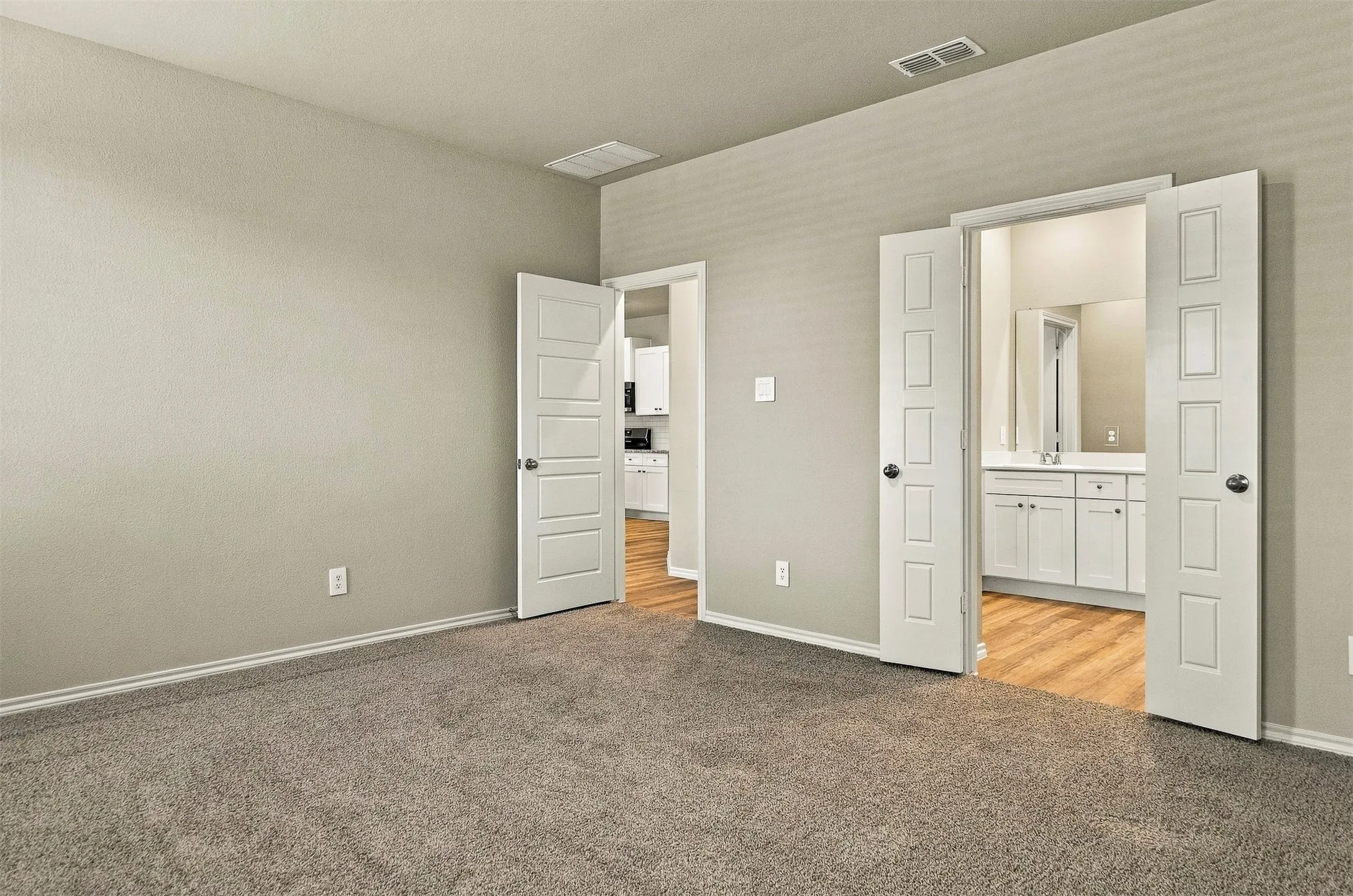 Plush carpet flooring with neutral wall paint