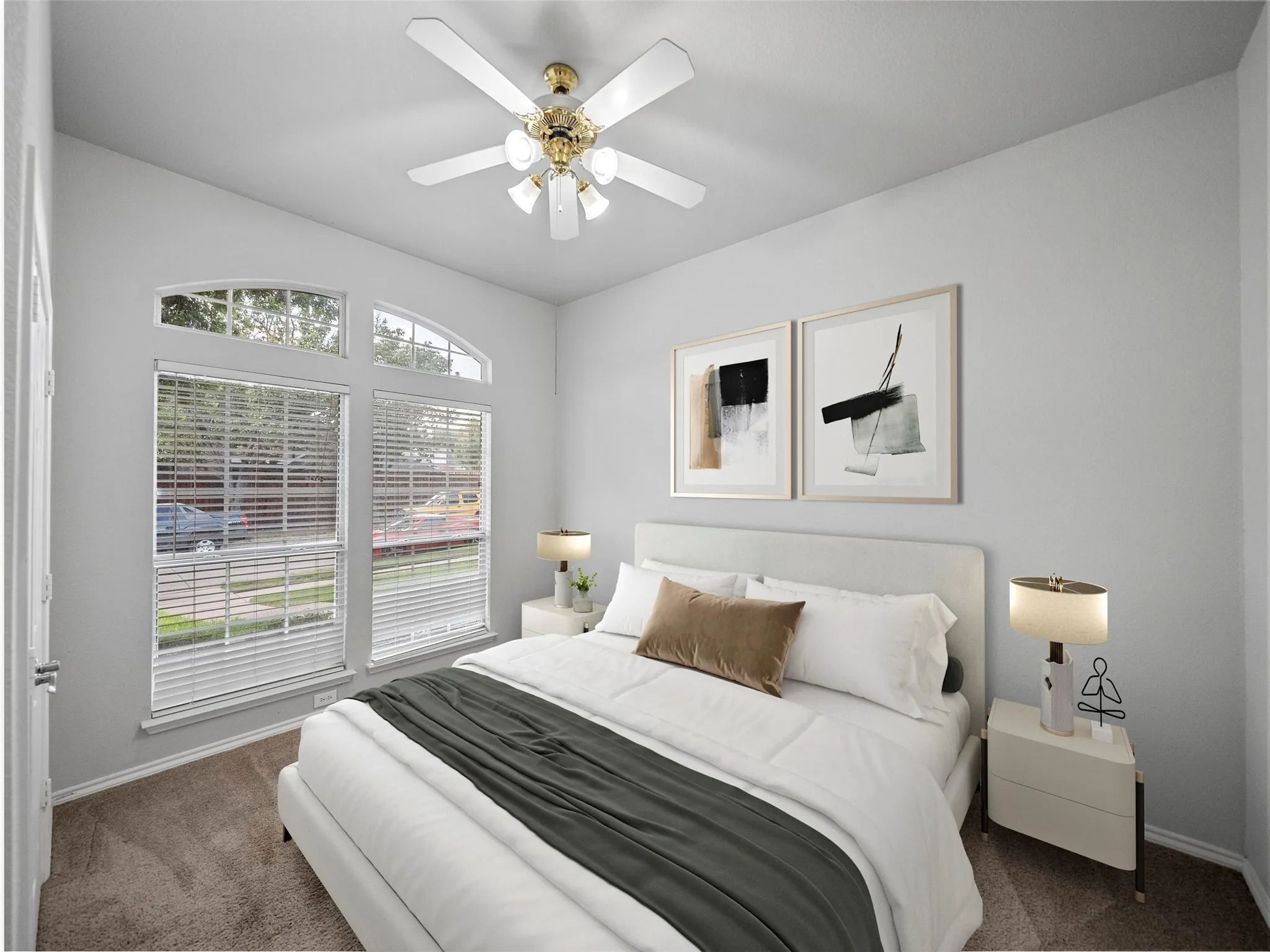 Arched transom windows, a ceiling fan with integrated lighting, and neutral wall paint