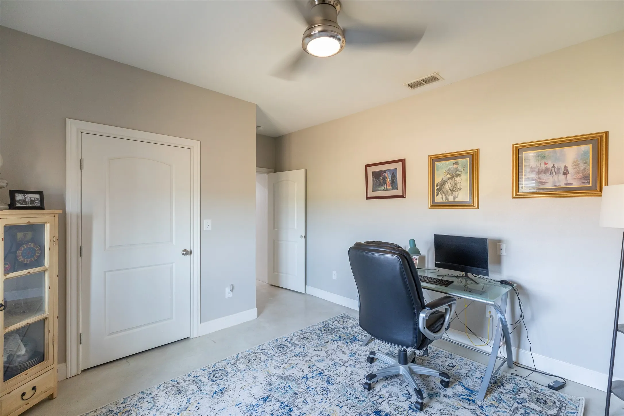 Neutral wall paint, white trim, and a ceiling fan with integrated lighting