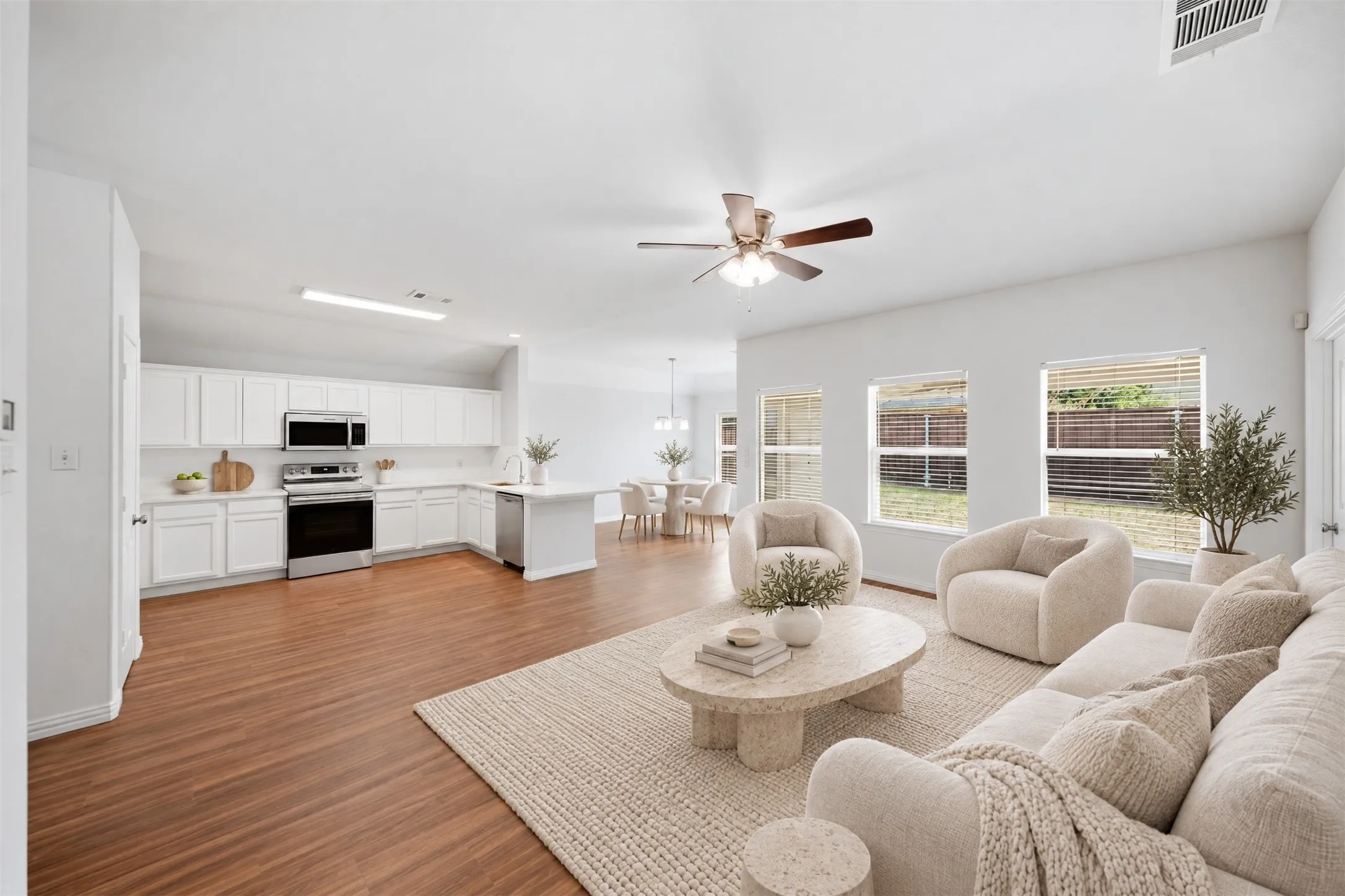 The heart of the home brings the family room, kitchen, and dining area together in one inviting space—perfect for sharing a meal, catching up at the end of the day, or welcoming friends over.
Virtual staged