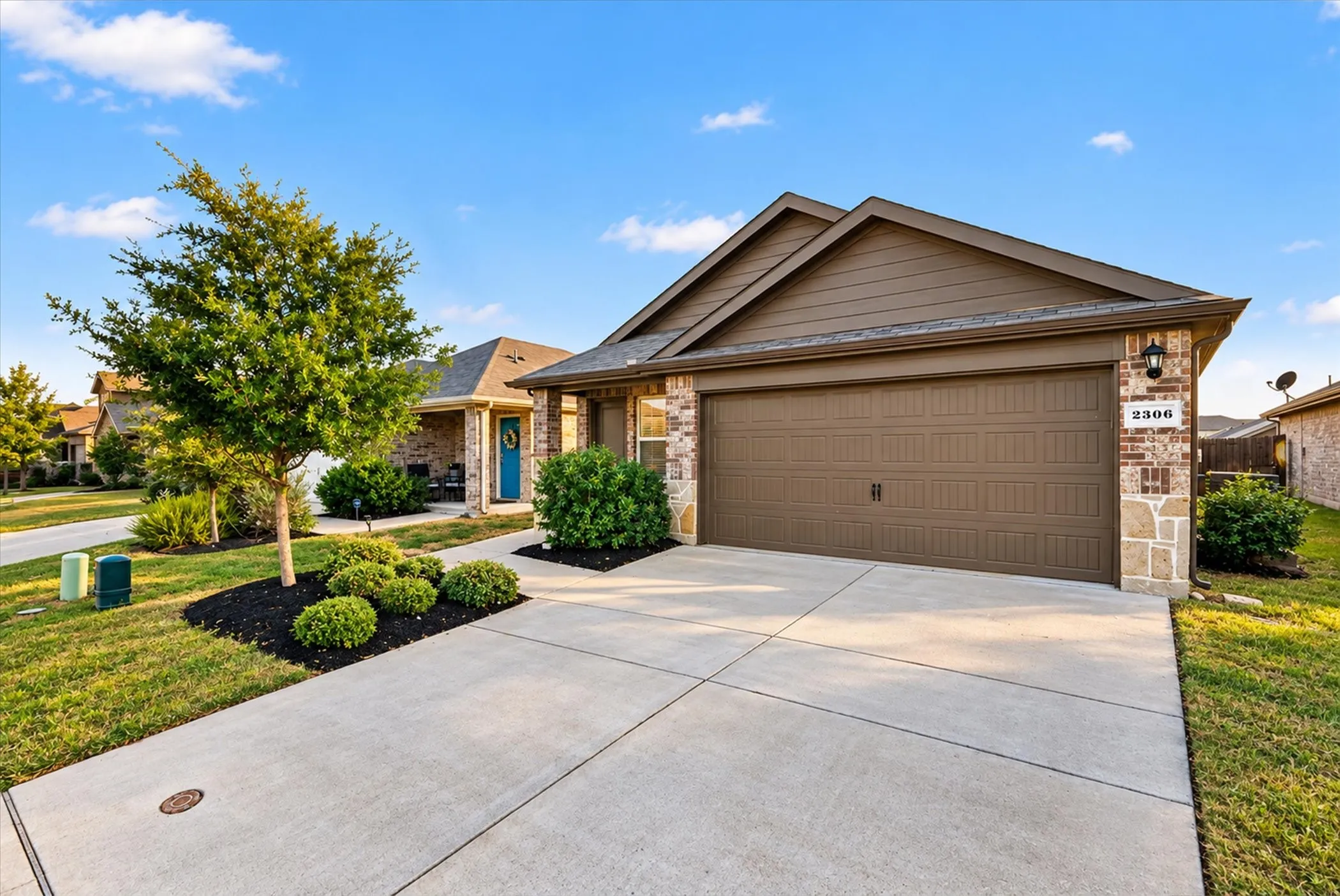 Brick and stone exterior with brown siding