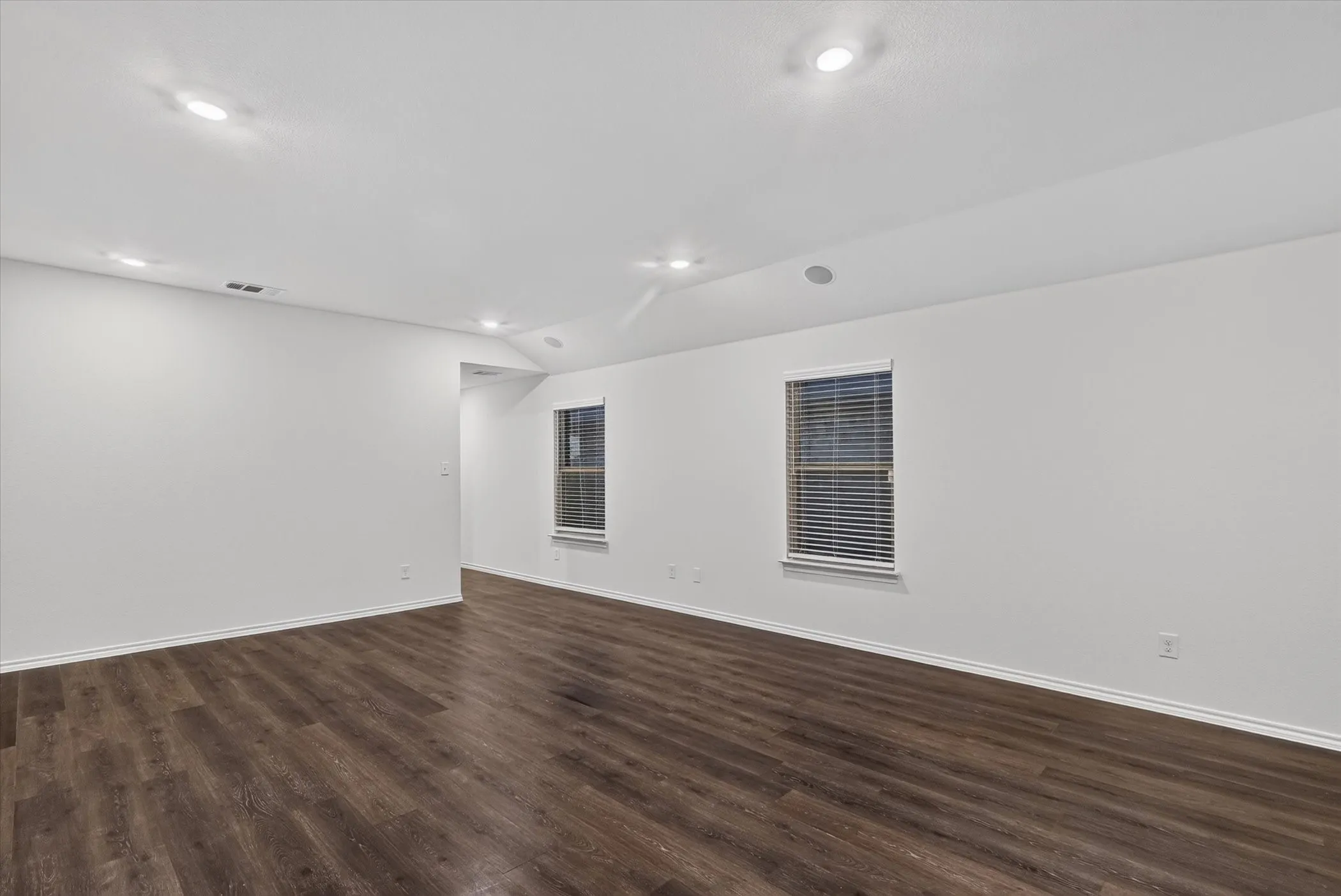 Recessed lighting and wood-finish flooring