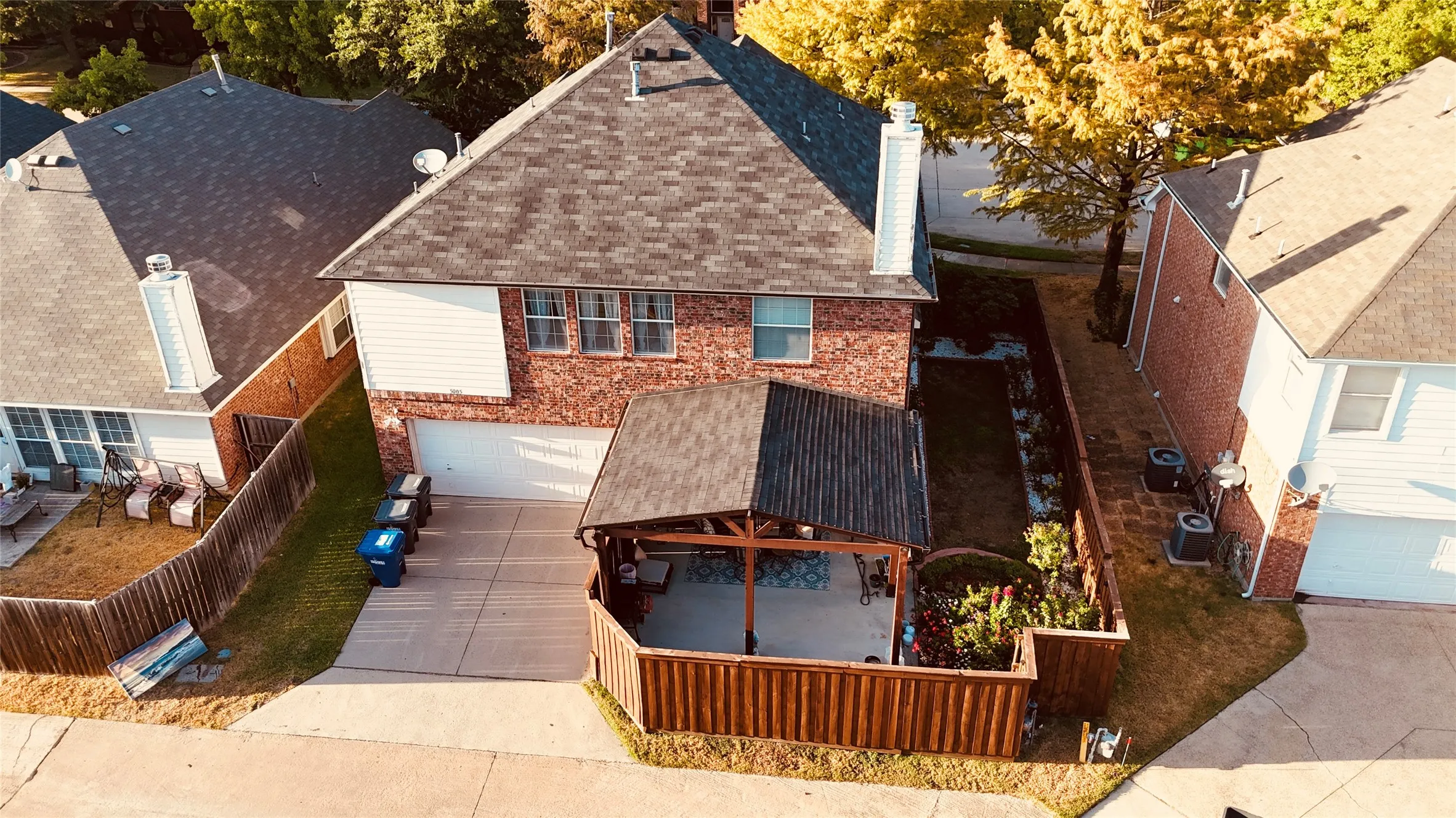 Brick and siding exterior with a shingled roof