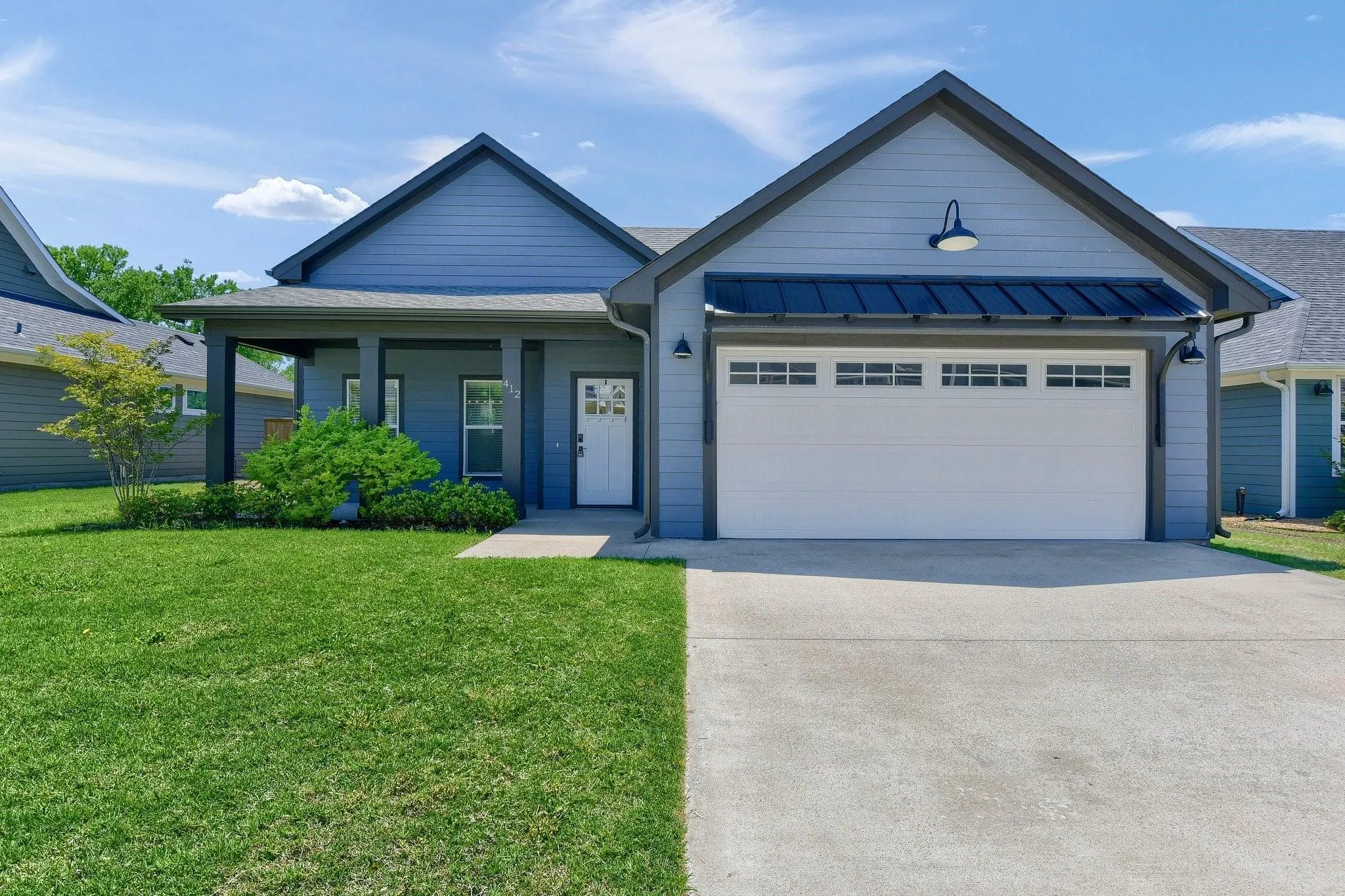 Blue siding exterior with contrasting dark trim
