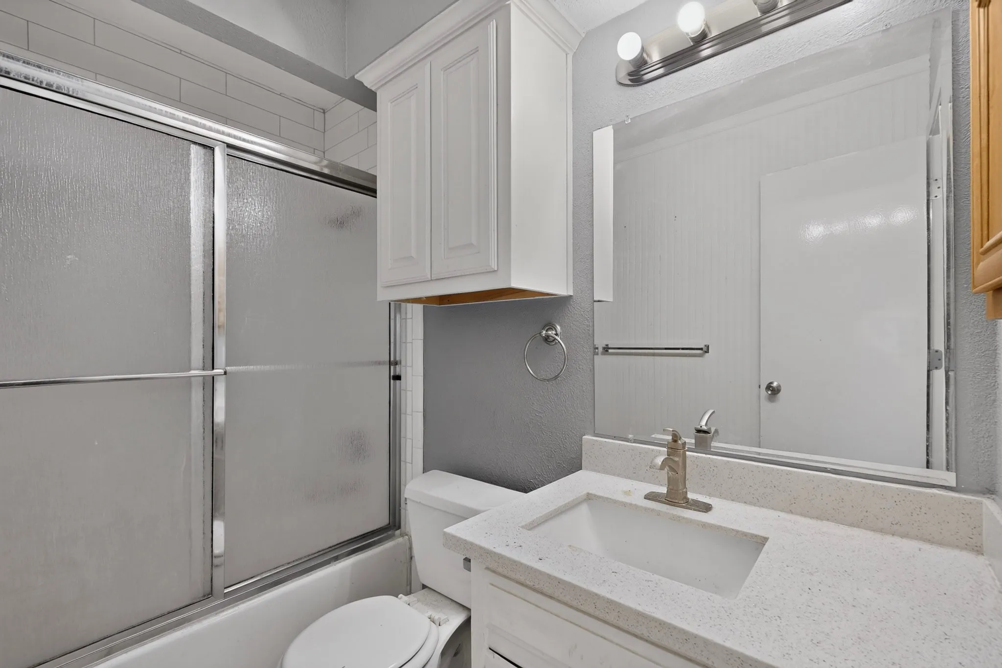Vanity with integrated sink and stone-finish countertop
