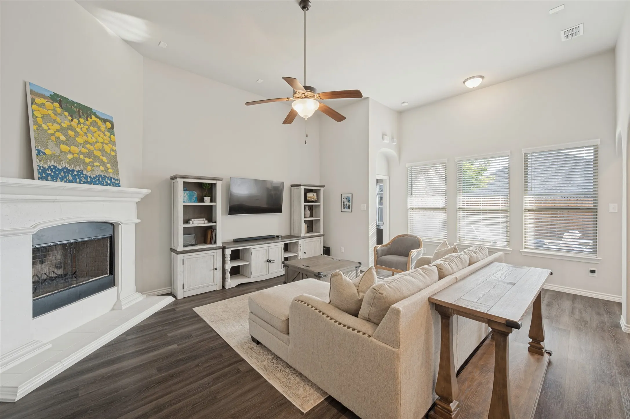 Vaulted ceilings, wood-finish flooring, and multiple windows