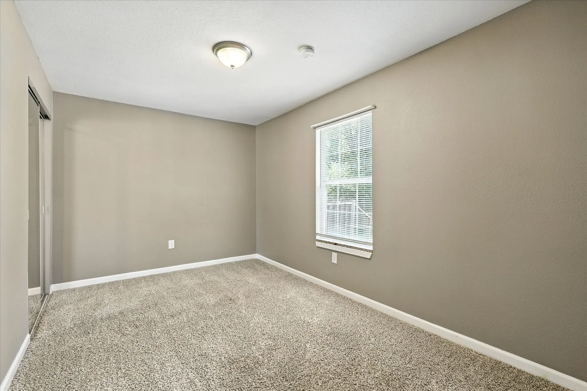 Third bedroom, view of back yard.