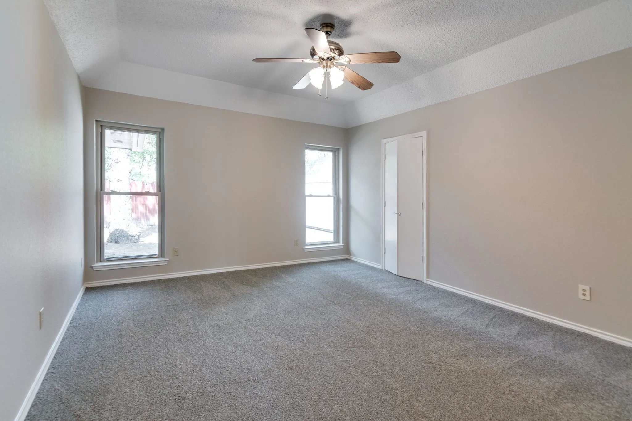 Large primary bedroom with new carpet just installed September 2026