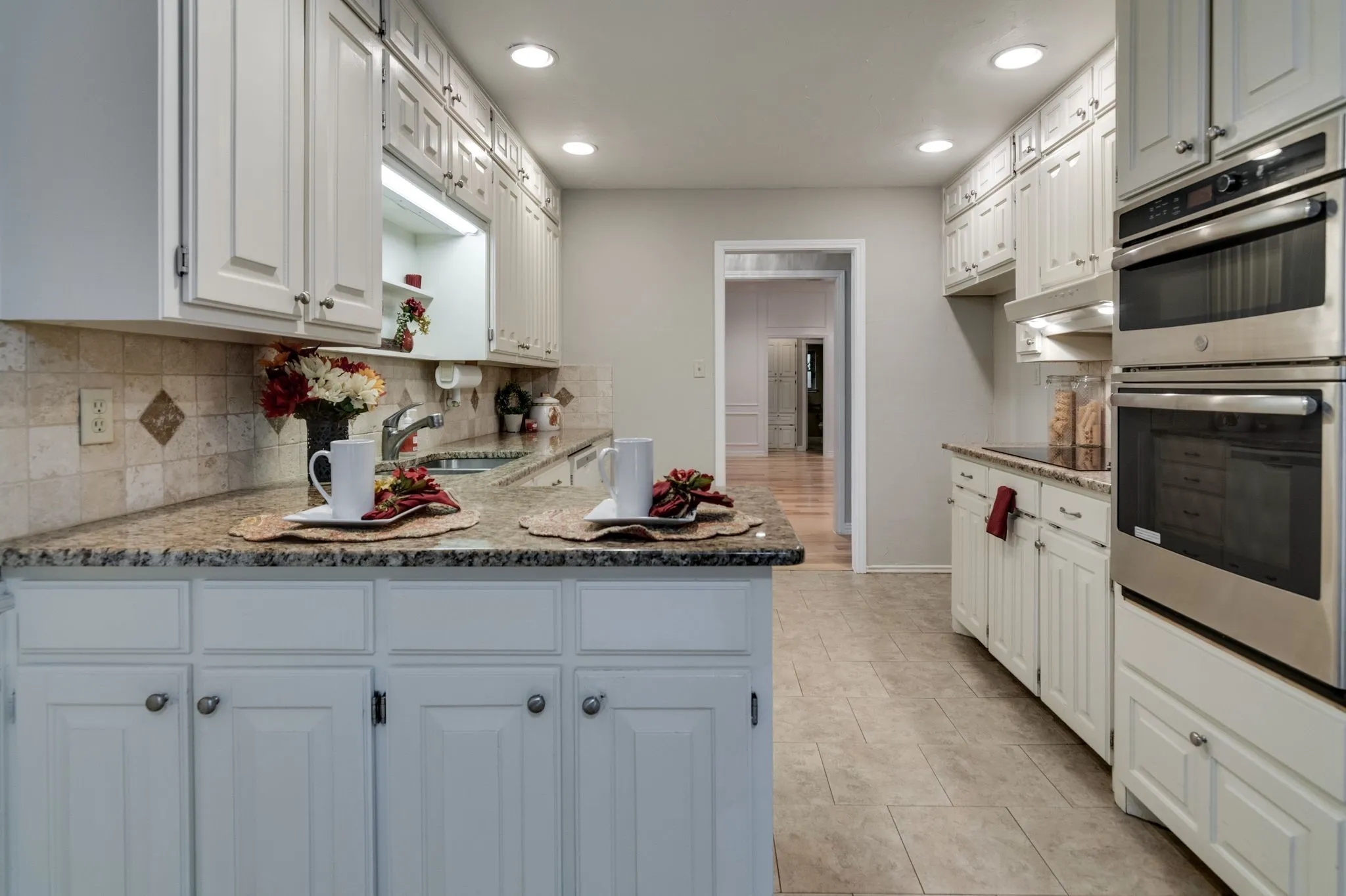 Petite breakfast bar area also offers more cabinet storage space!!!