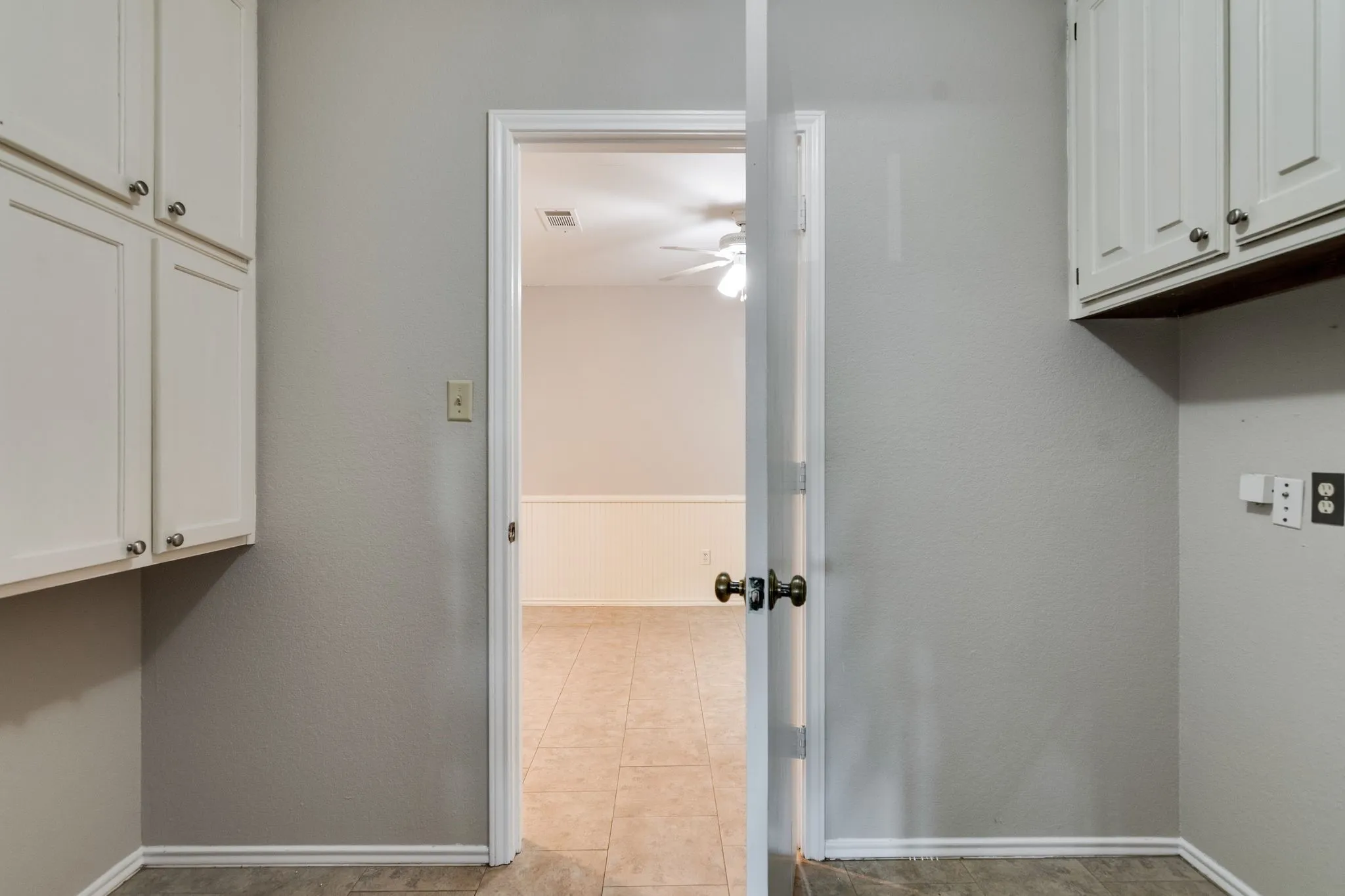 Very large utility room offers space for both laundry and pantry space
