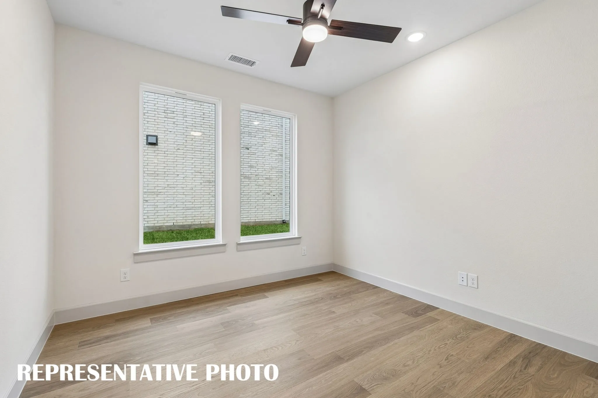 The professional working from home will appreciate this private, light filled home office.  REPRESENTATIVE PHOTO