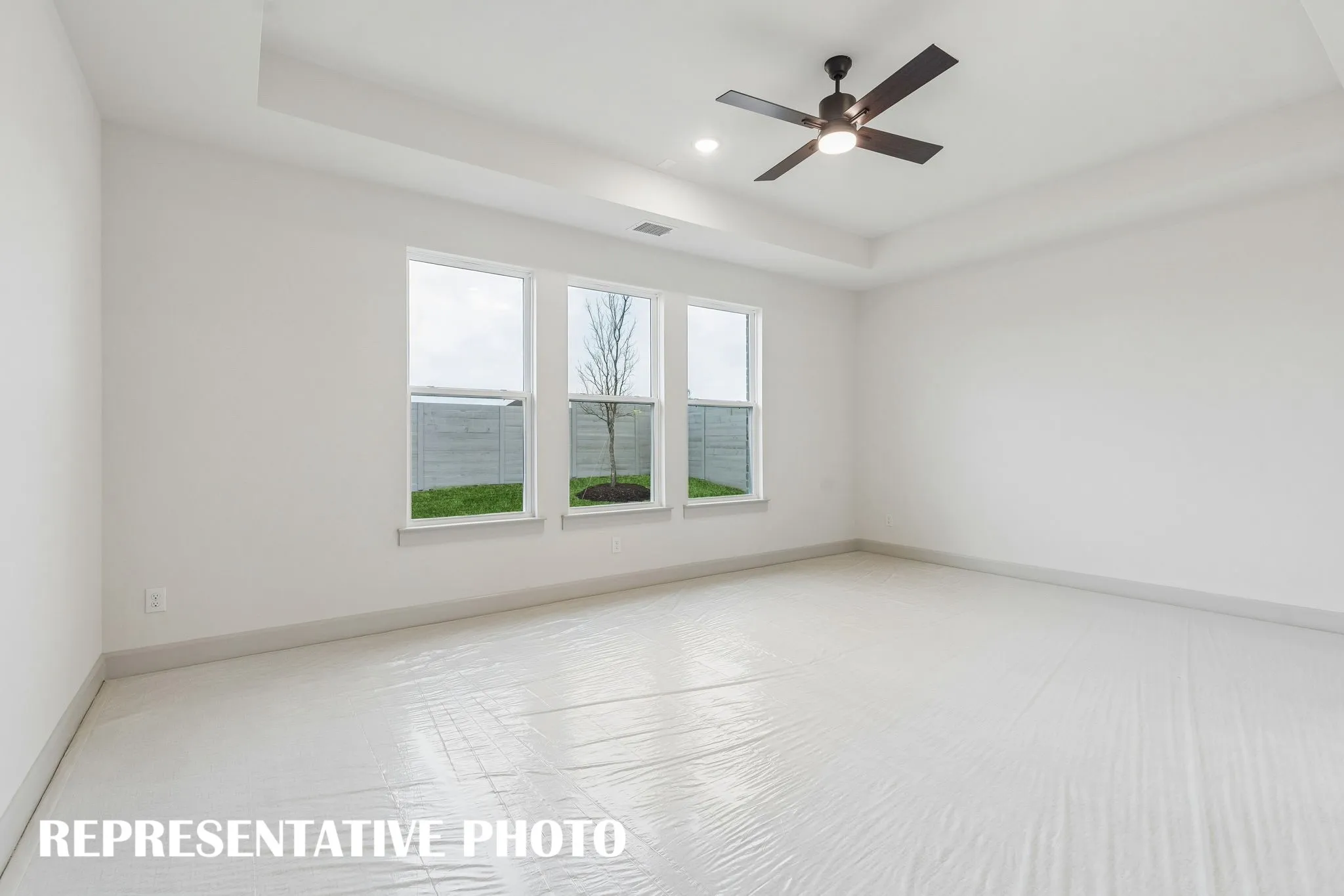 High ceilings, plush carpet and oversized windows create a peaceful and relaxing owner's suite.  REPRESENTATIVE PHOTO