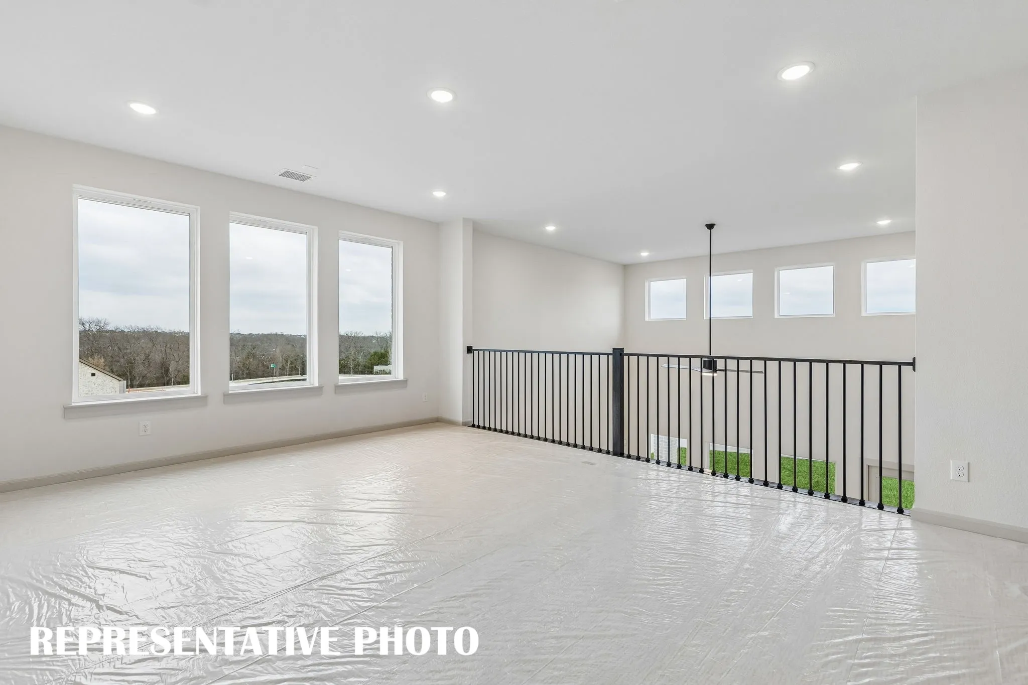 You'll enjoy hosting big game day parties or family game night in this spacious game room!  REPRESENTATIVE PHOTO