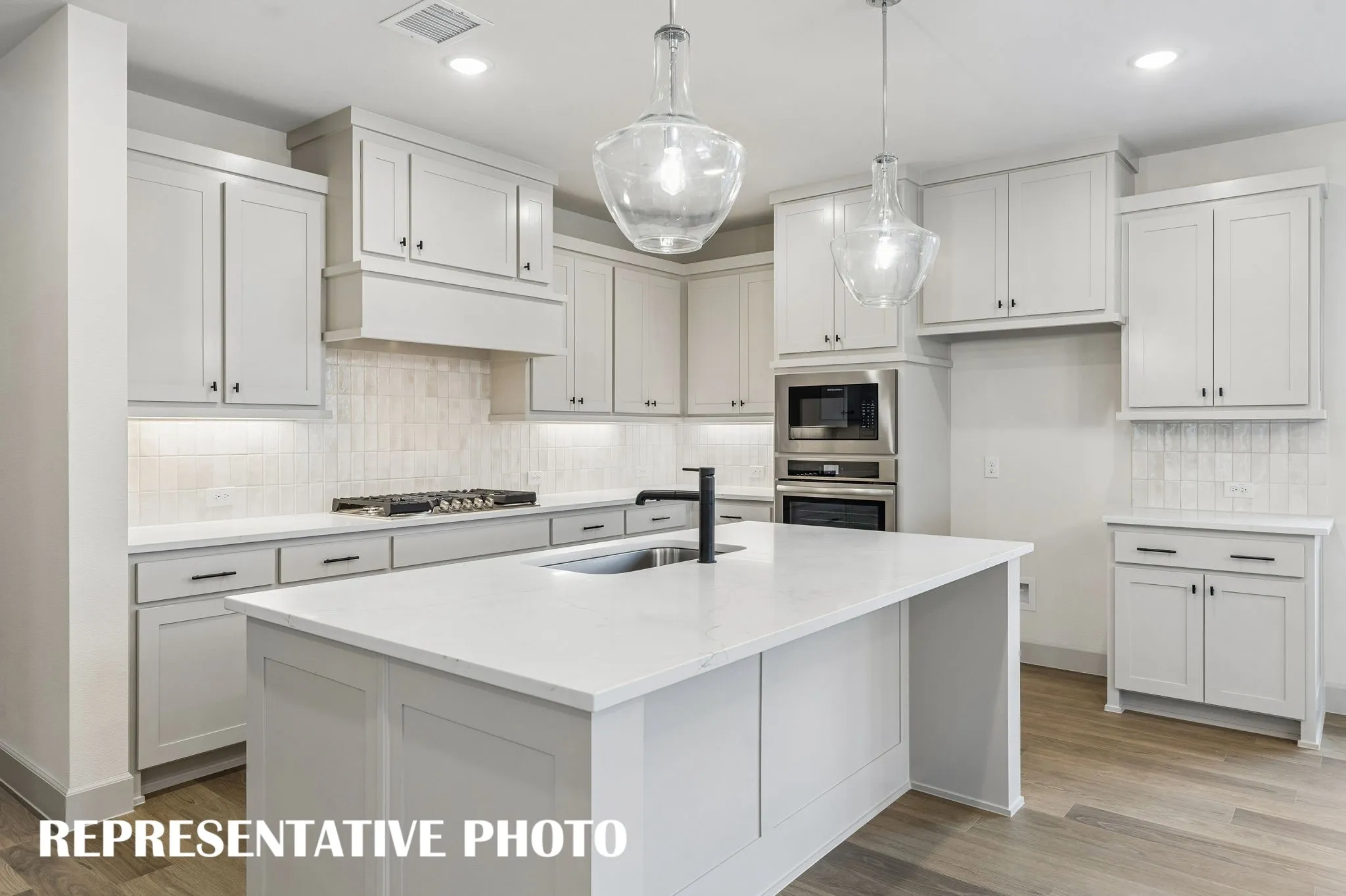 This outstanding kitchen offers ample space for all the chef's in the family to create!  REPRESENTATIVE PHOTO