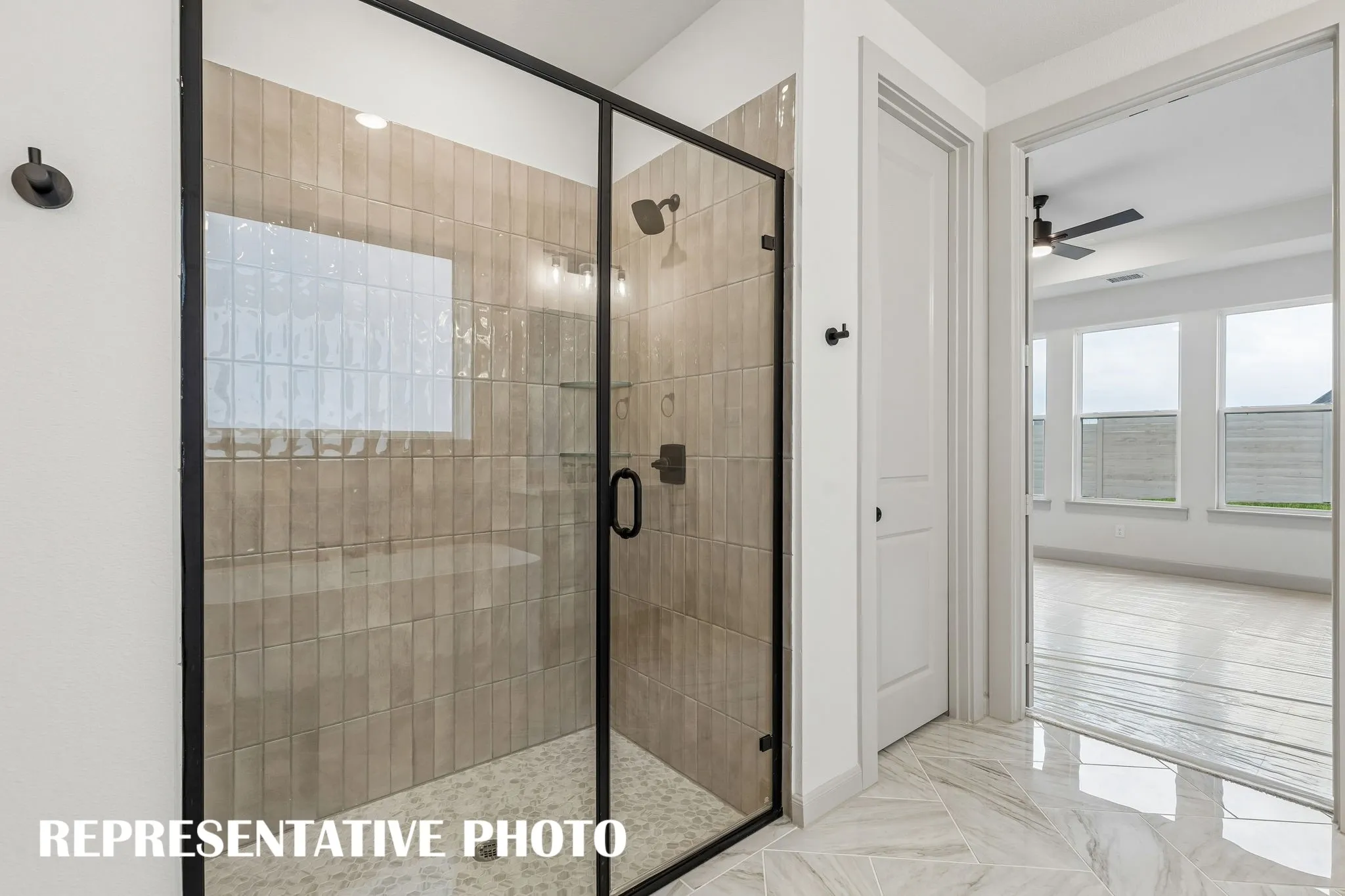 This dream owner's bath features a freestanding tub plus an oversized walk in shower!  REPRESENTATIVE PHOTO