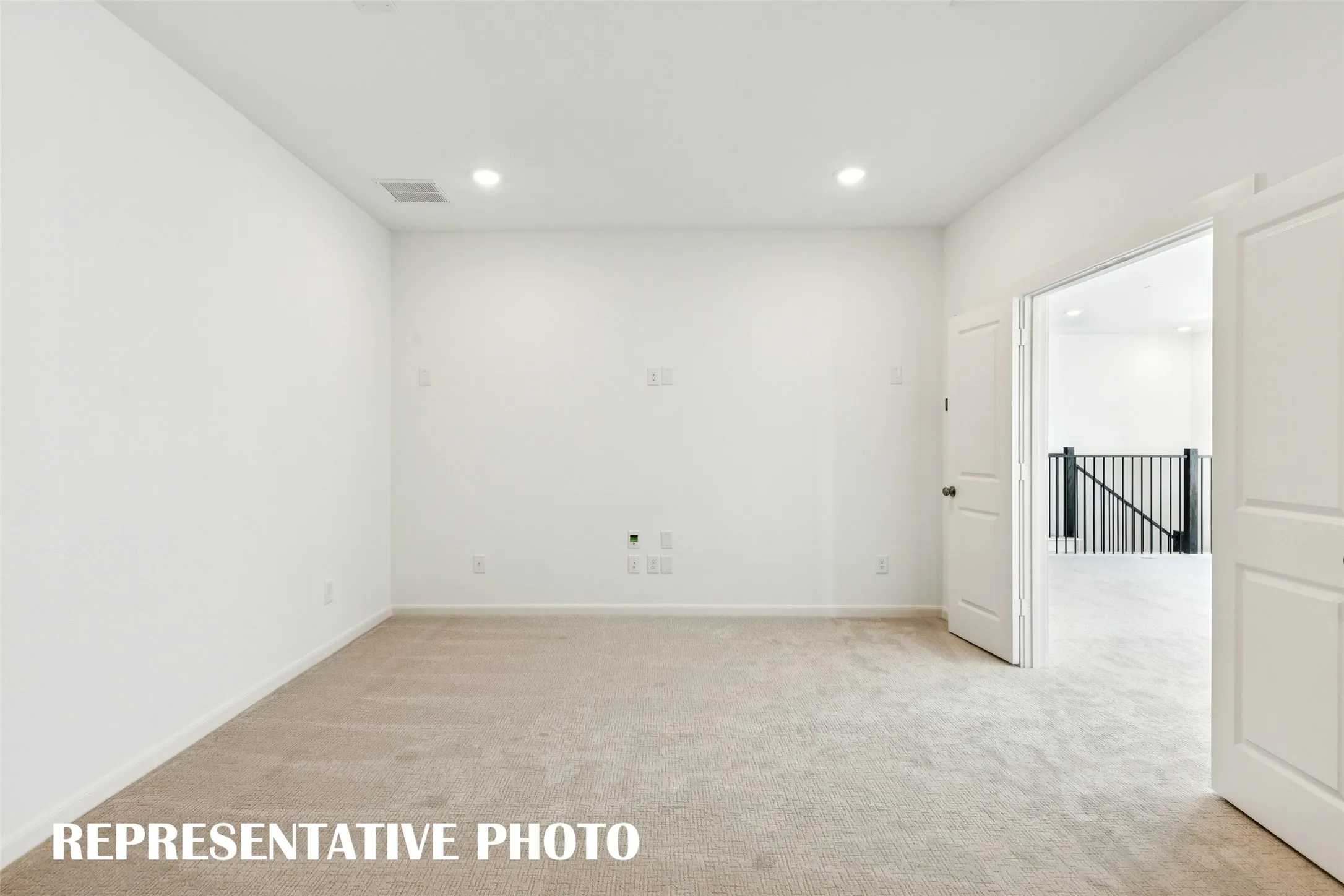This spacious media room with adjoining game room create the ultimate family entertainment zone!  REPRESENTATIVE PHOTO