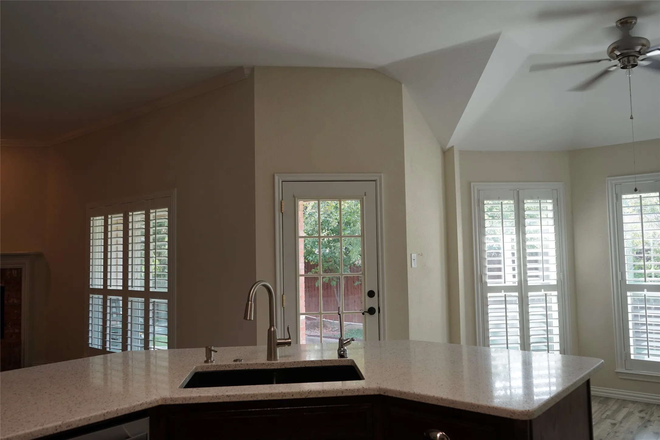 Kitchen island with an undermount sink and a gooseneck faucet
