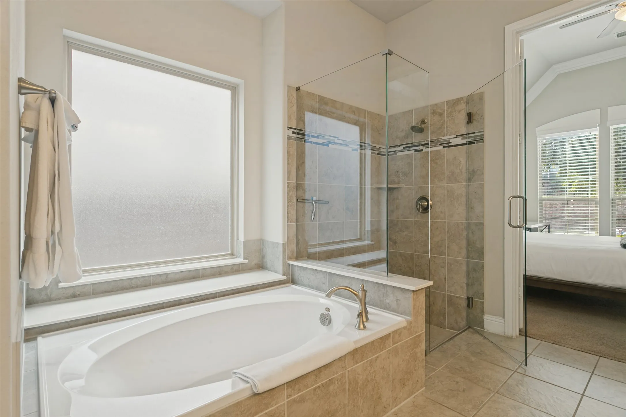Soaking tub with deck-mounted faucet