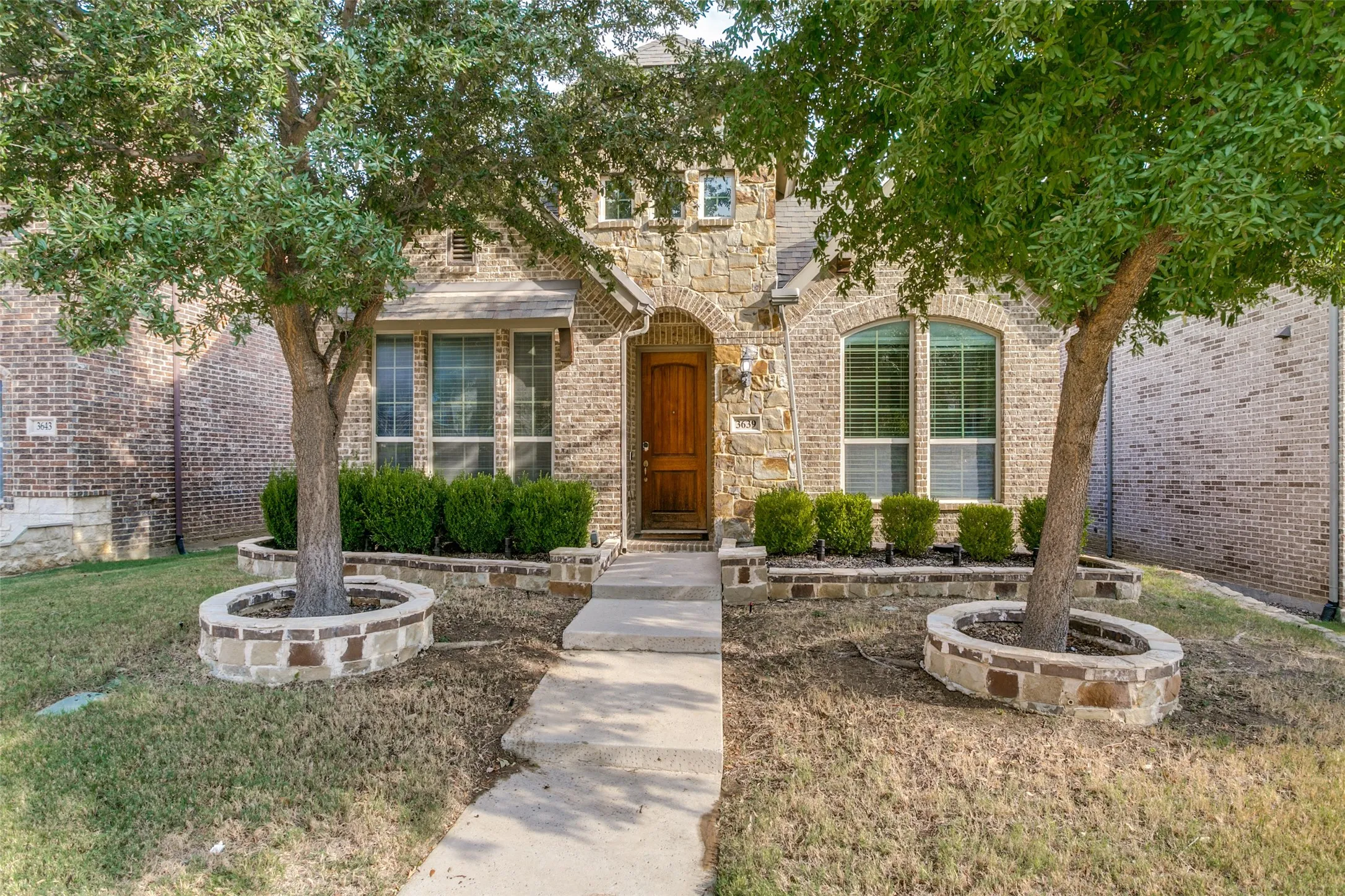 Stone and brick exterior with arched entry