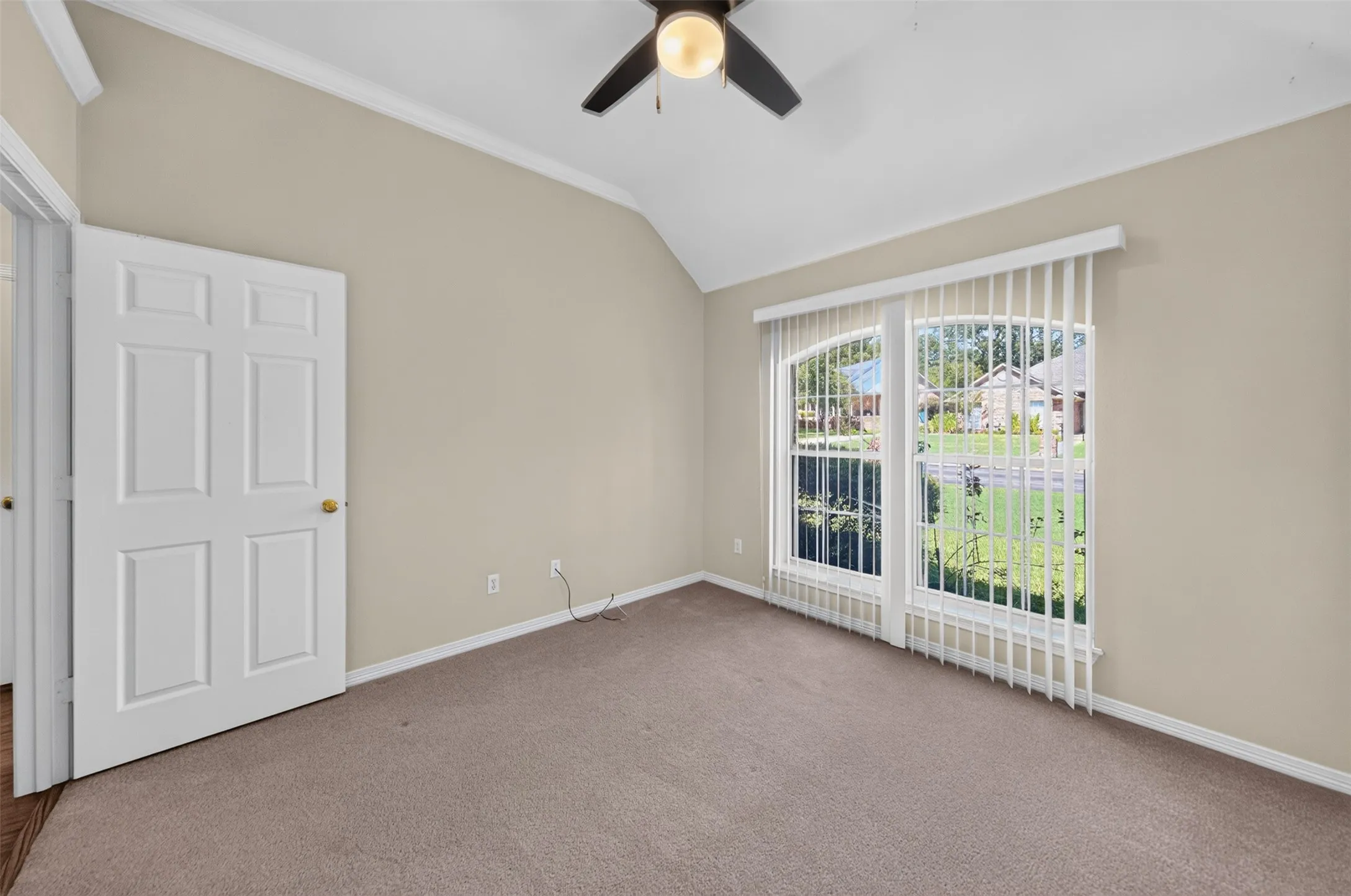 View of one of the bedroom on the front of the home.  Oversees the homes across the street and landscapped front yard
