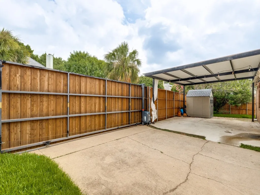Extra covered parking near garage with large electic gate