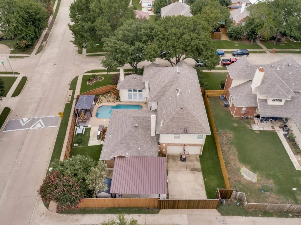 This aerial is facing south from the back of the home at alley