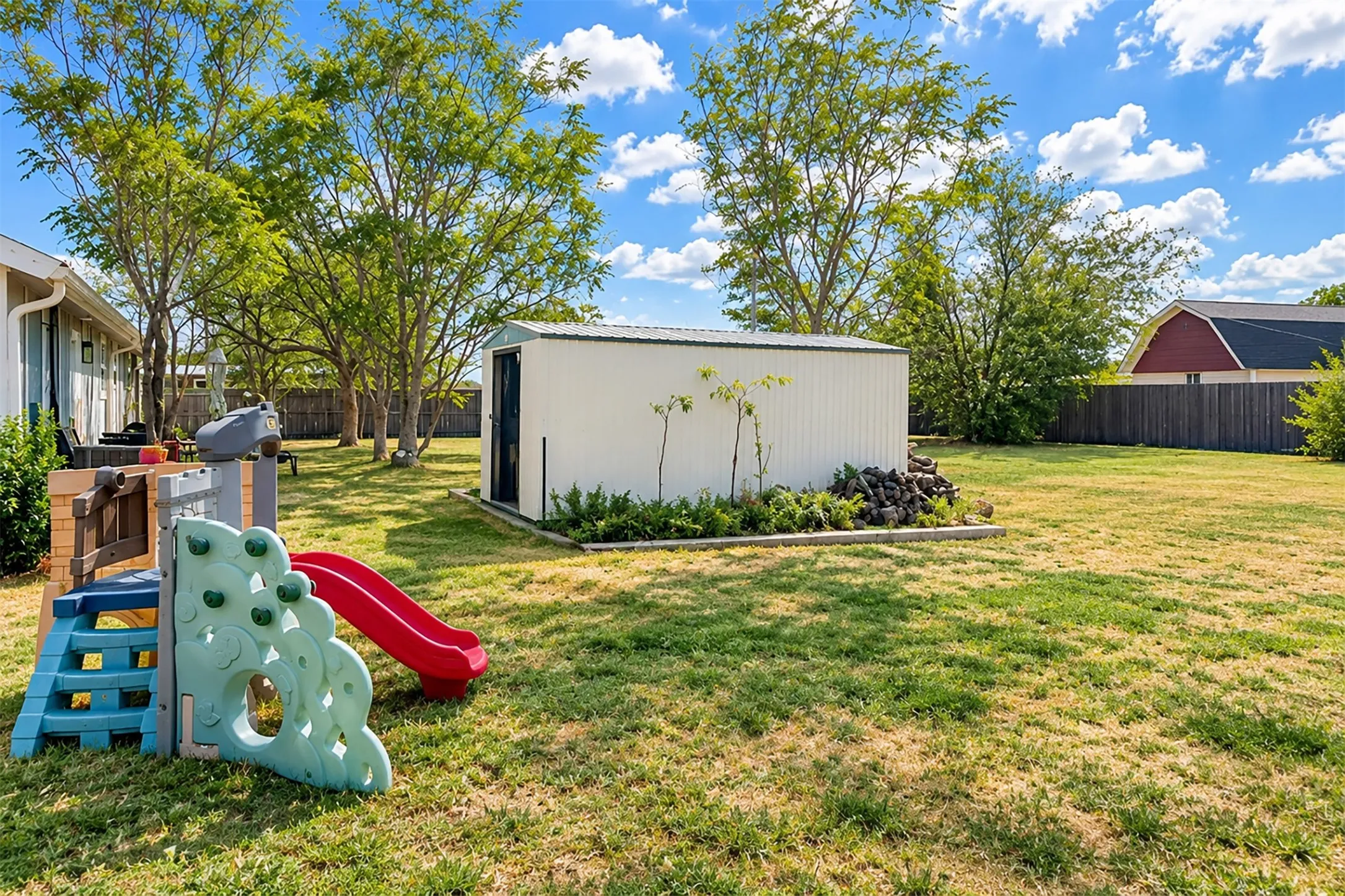 right side of the backyard with storage shed.
