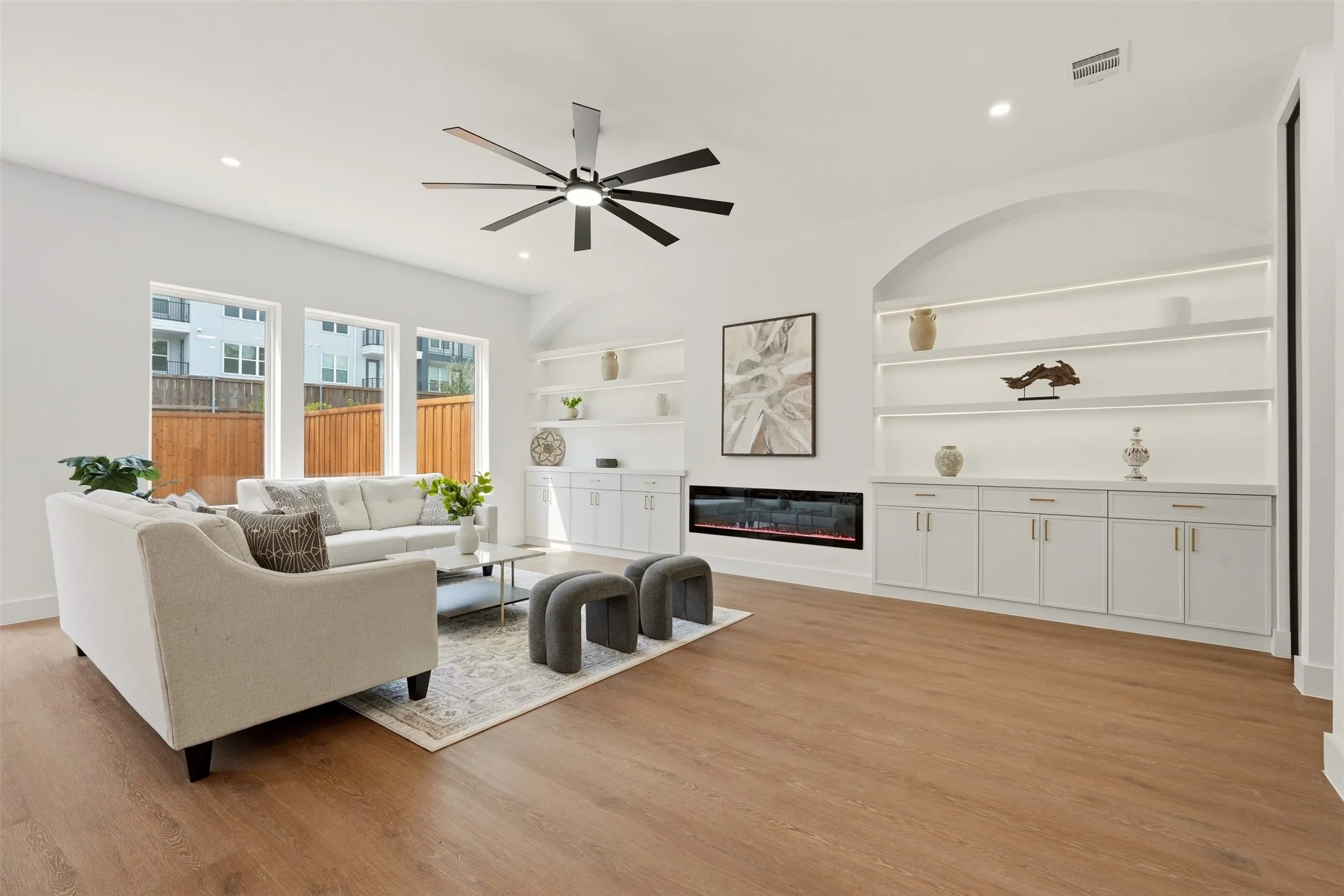 Wood-finish flooring, recessed lighting, and a modern ceiling fan