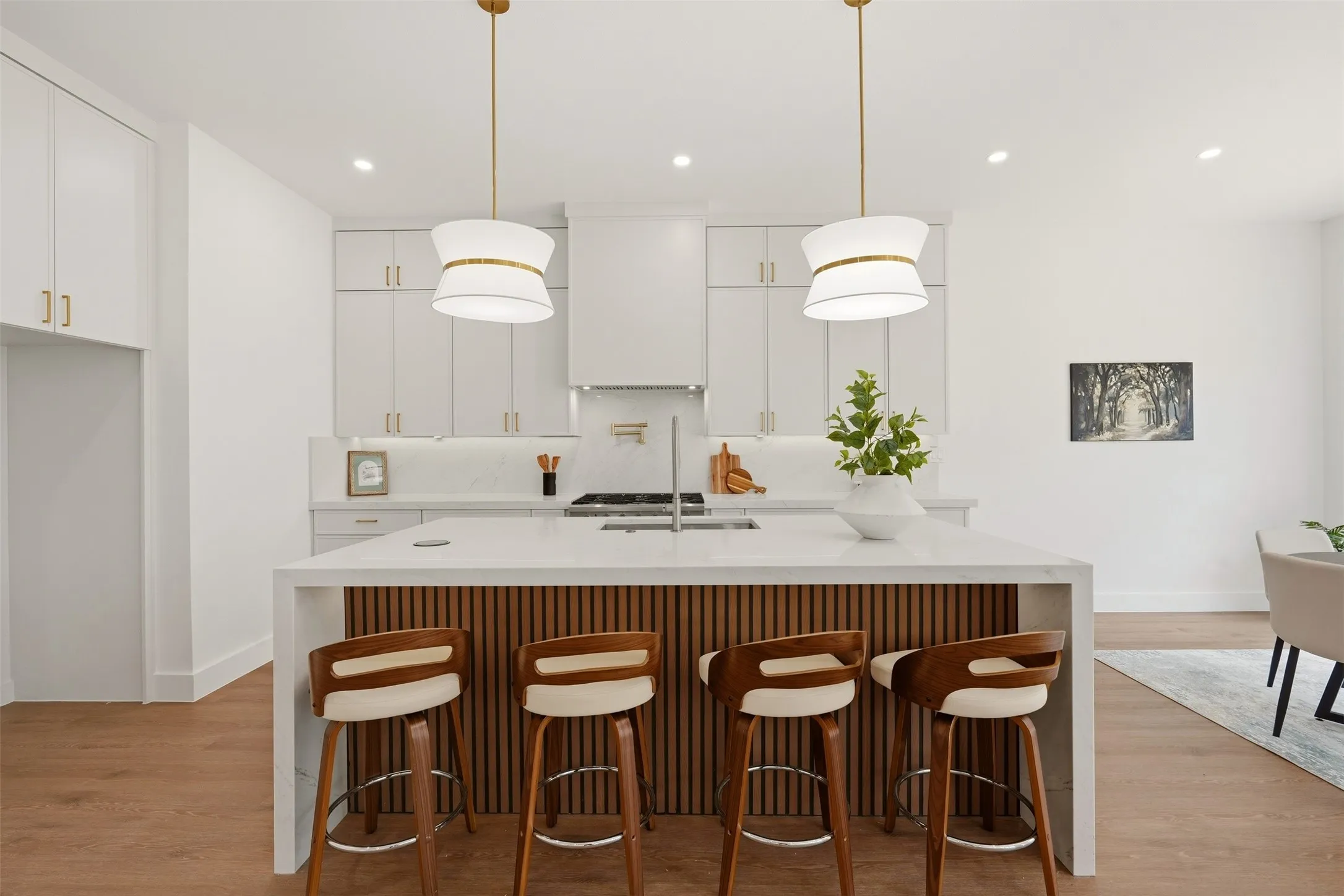 Kitchen island with a white countertop and wood-finish paneling
