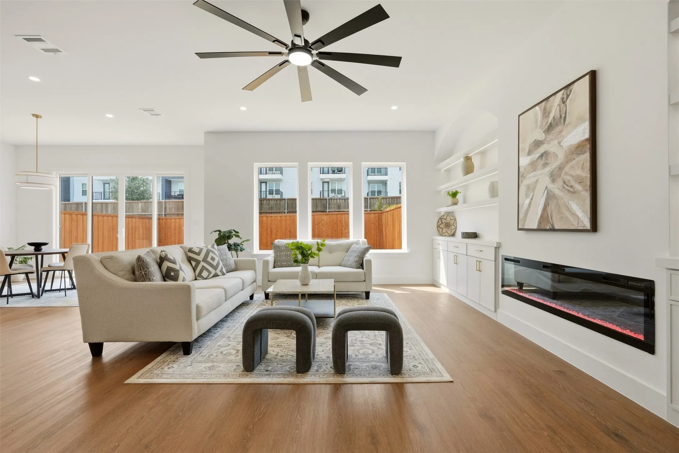 Wood-finish flooring, recessed lighting, and a modern ceiling fan