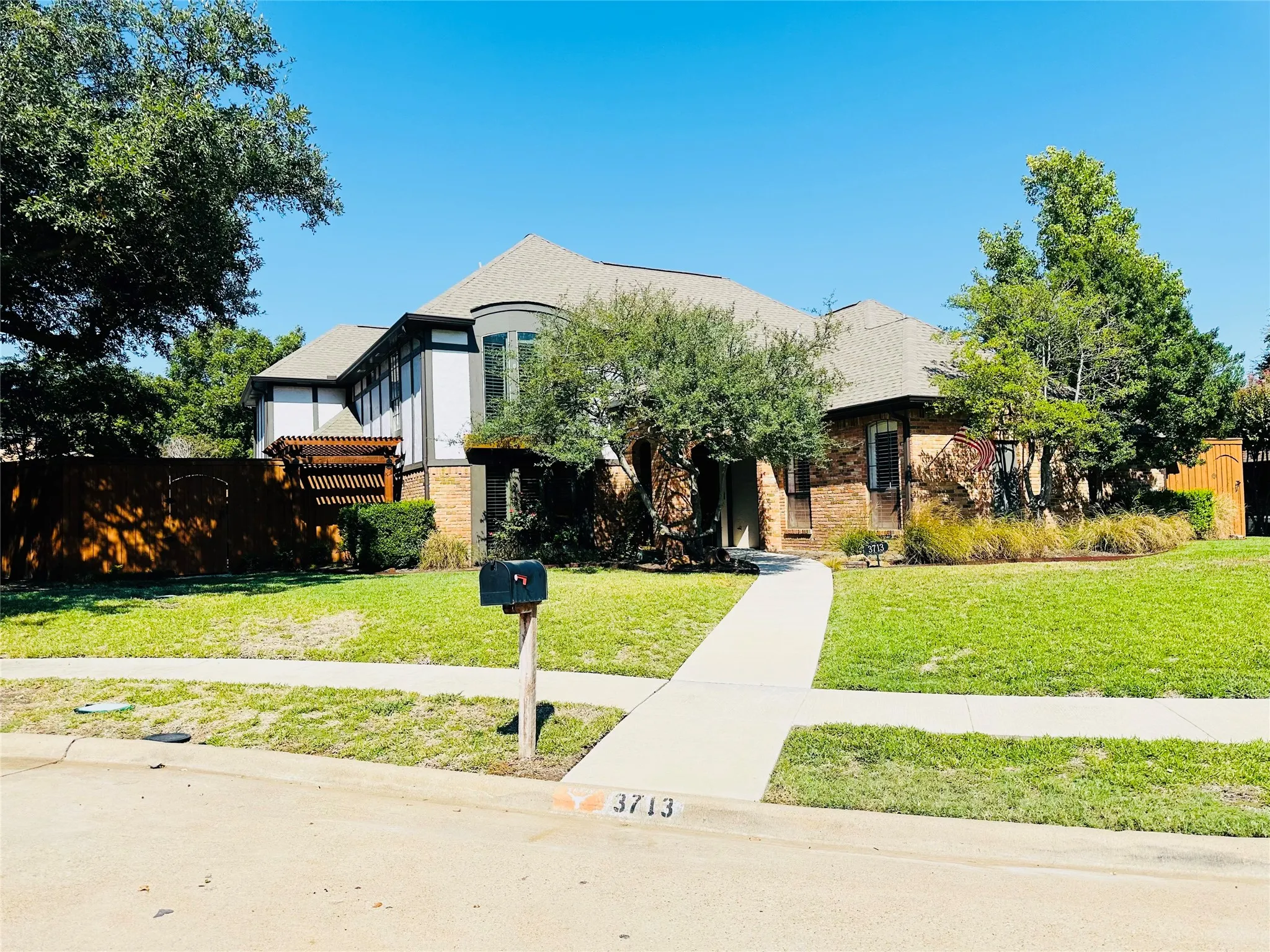 Brick and stucco exterior with a prominent bay window