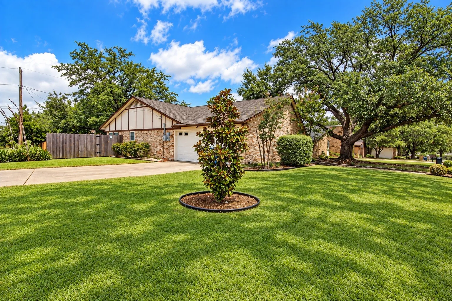 Large, well-maintained corner lot. Oversized side-entry garage.