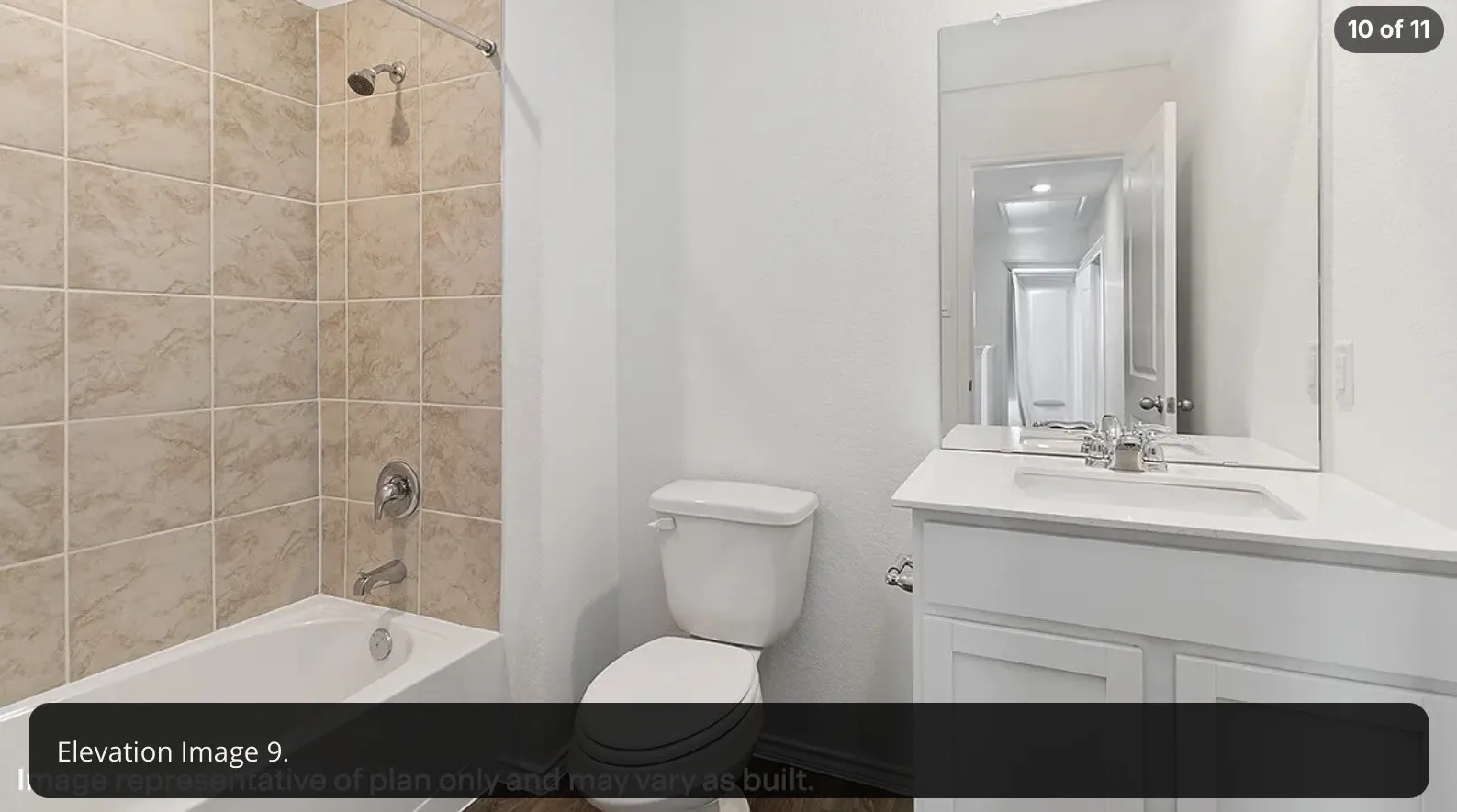 Bathroom featuring a tub/shower combination with ceramic tile surround, a single vanity with a white countertop, and a wall-mounted mirror