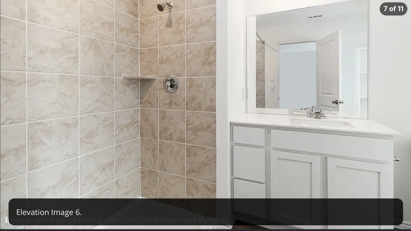 White vanity with a single basin, stainless steel faucet, and a large wall-mounted mirror