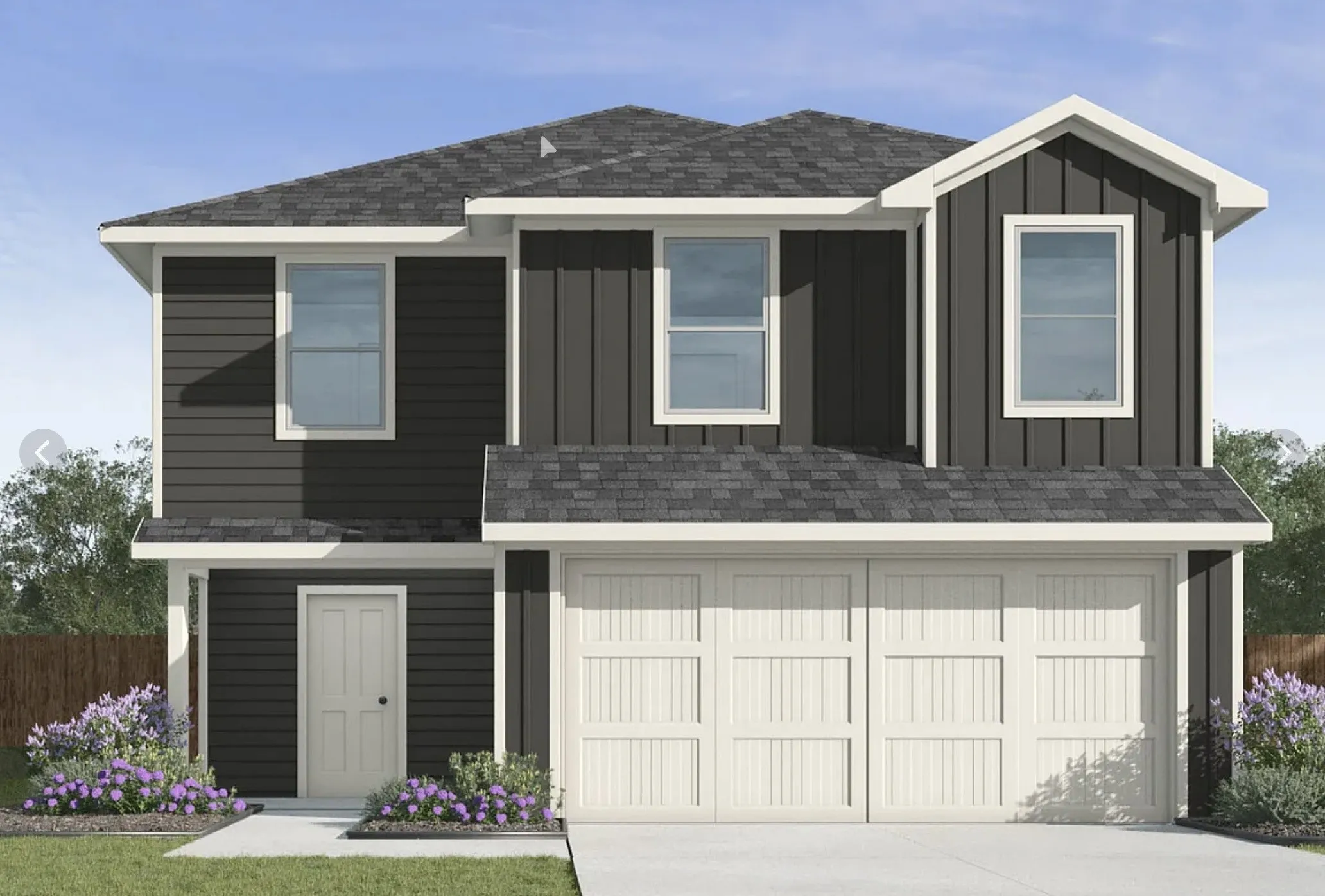 Two-story exterior with dark horizontal siding and vertical accent panels, an attached two-car garage, white trim, and a prominent front entry door