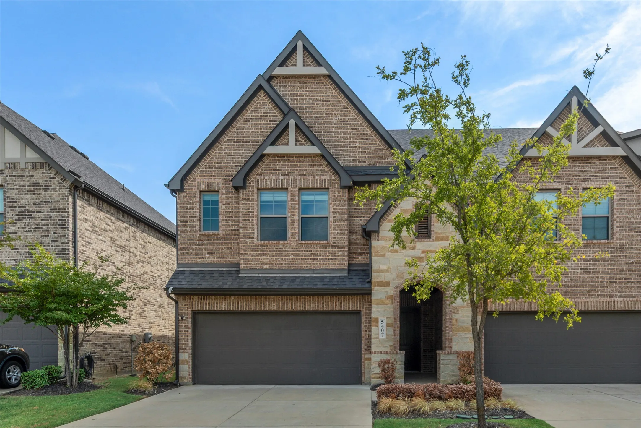 Brick and stone exterior with gabled roof lines
