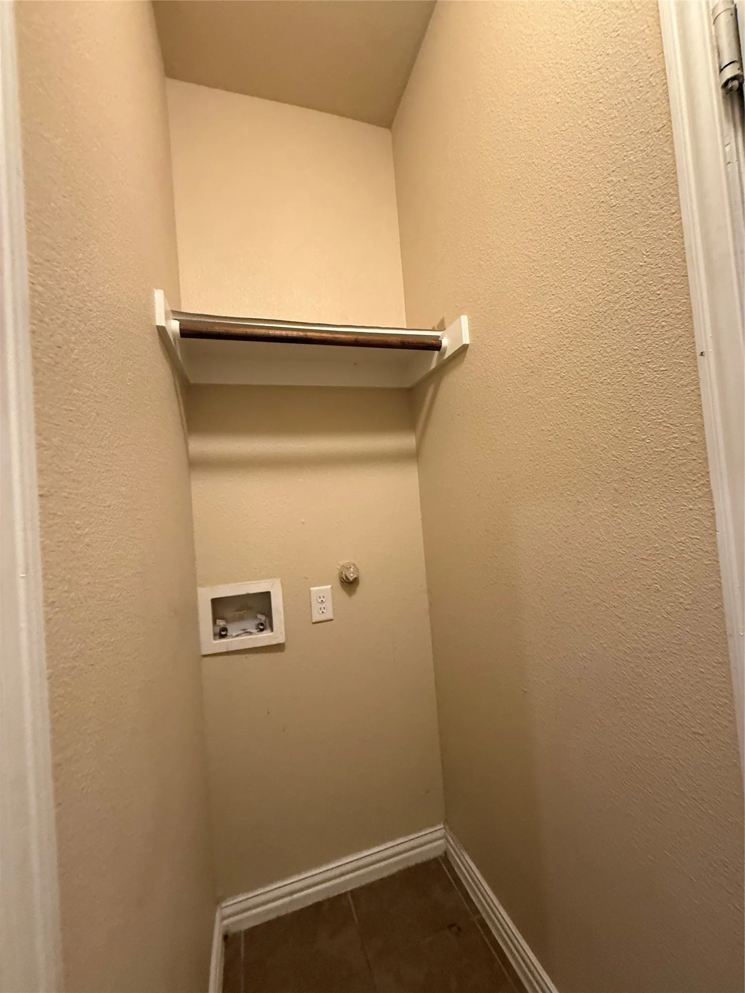 Between Garage and house.