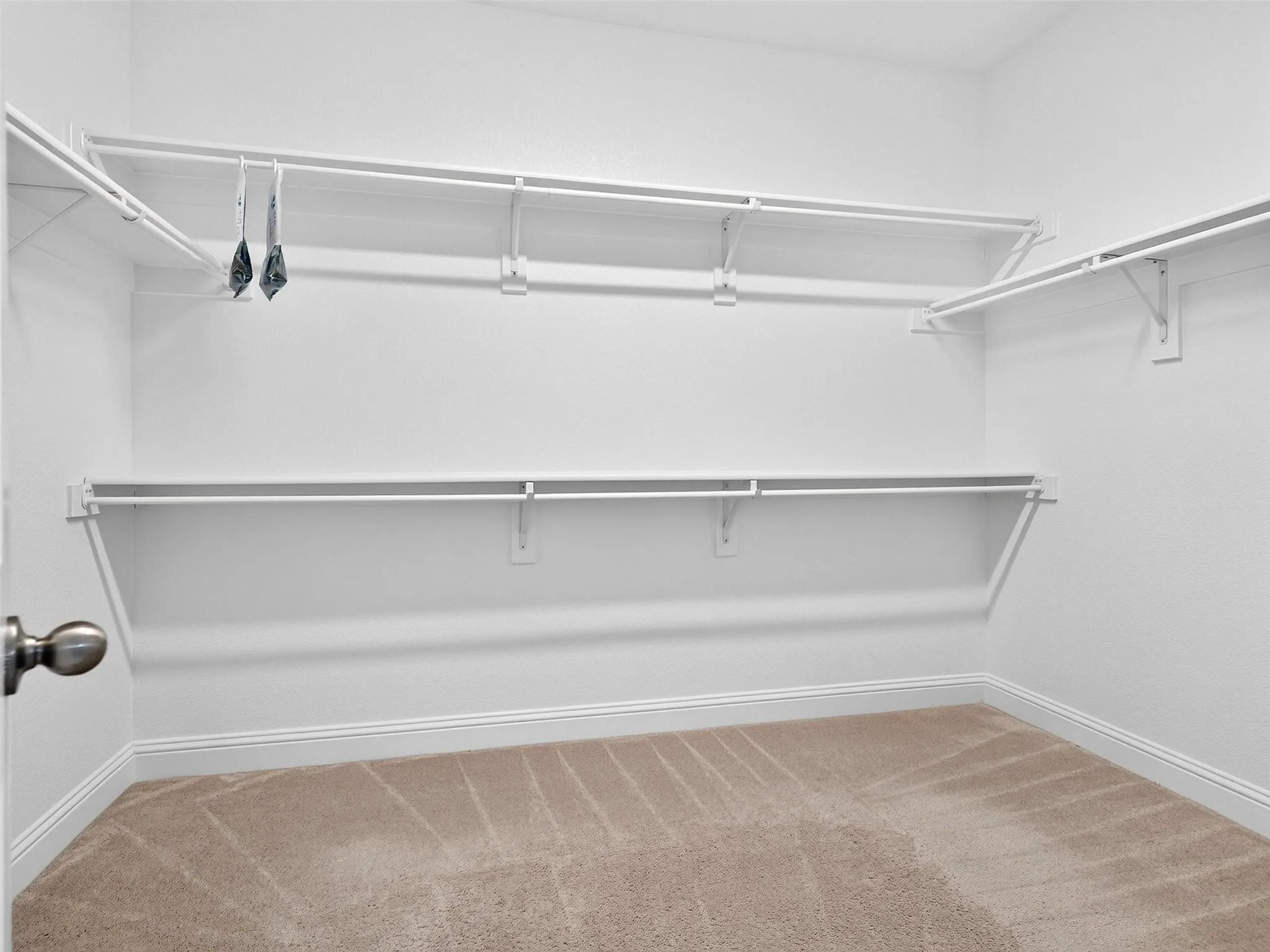 Wall-mounted wire shelving and hanging rods