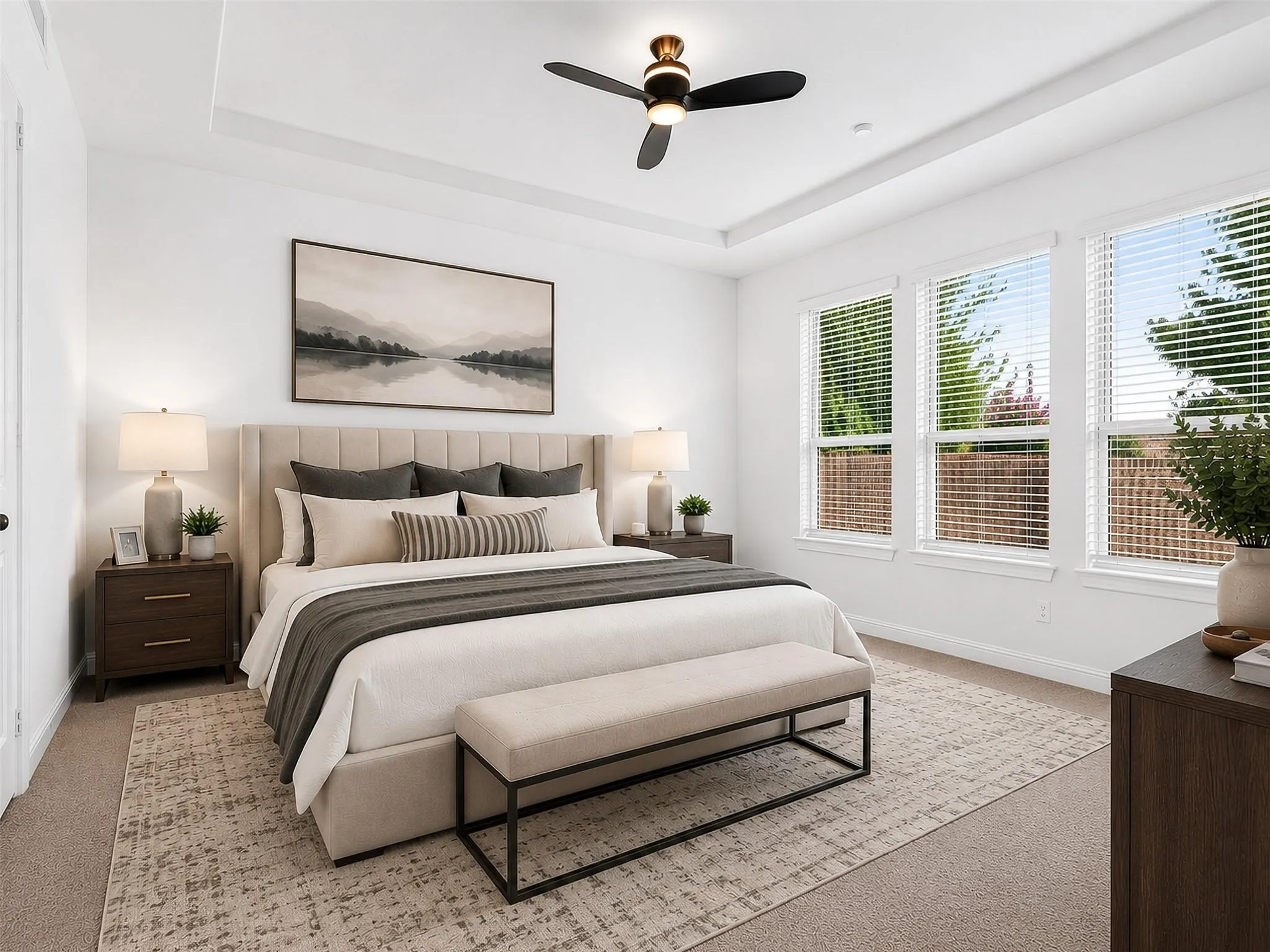 Tray ceiling, contemporary ceiling fan, multiple windows with blinds, light-colored carpeting