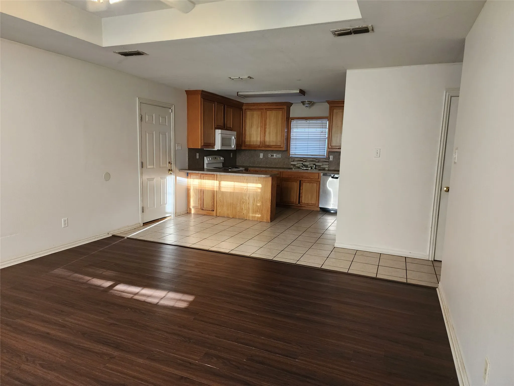 Hardwood-style flooring in living area