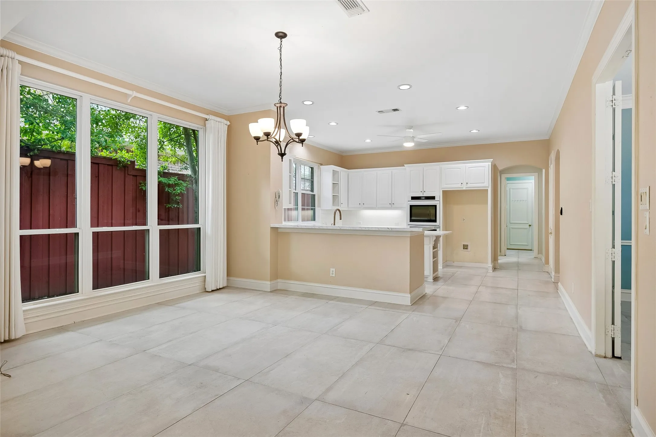 Spacious dining area with custom drapes accommodates huge tables and many guests