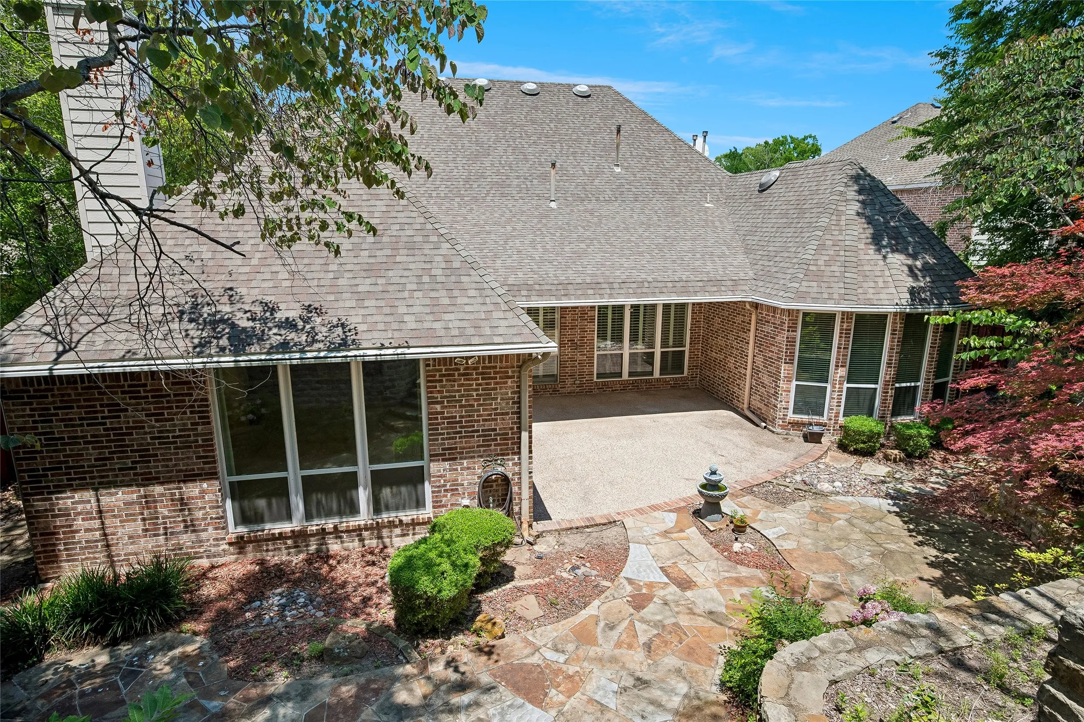Beautiful patio and tiered garden. Lot extends on highest level. Property behind will not be built on.