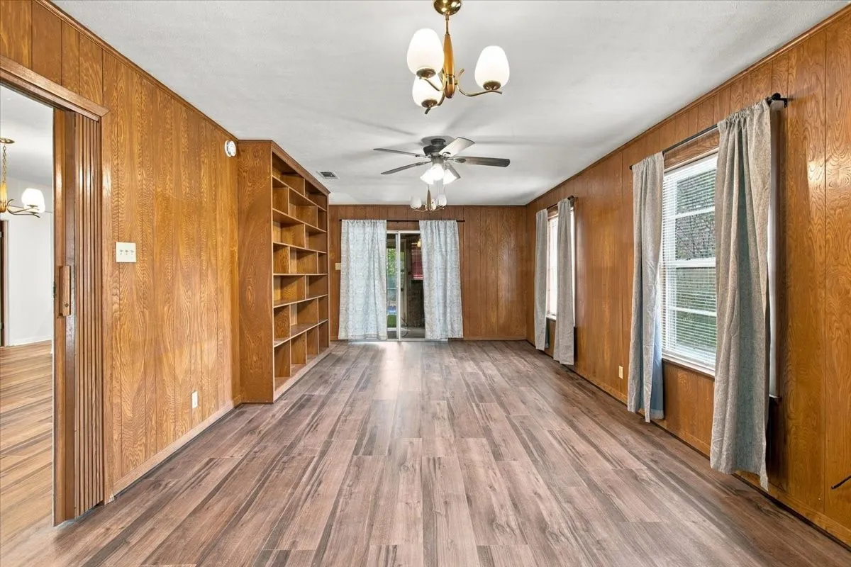 View #2 of Den looking towards sliding glass door leading to sunroom/back yard.